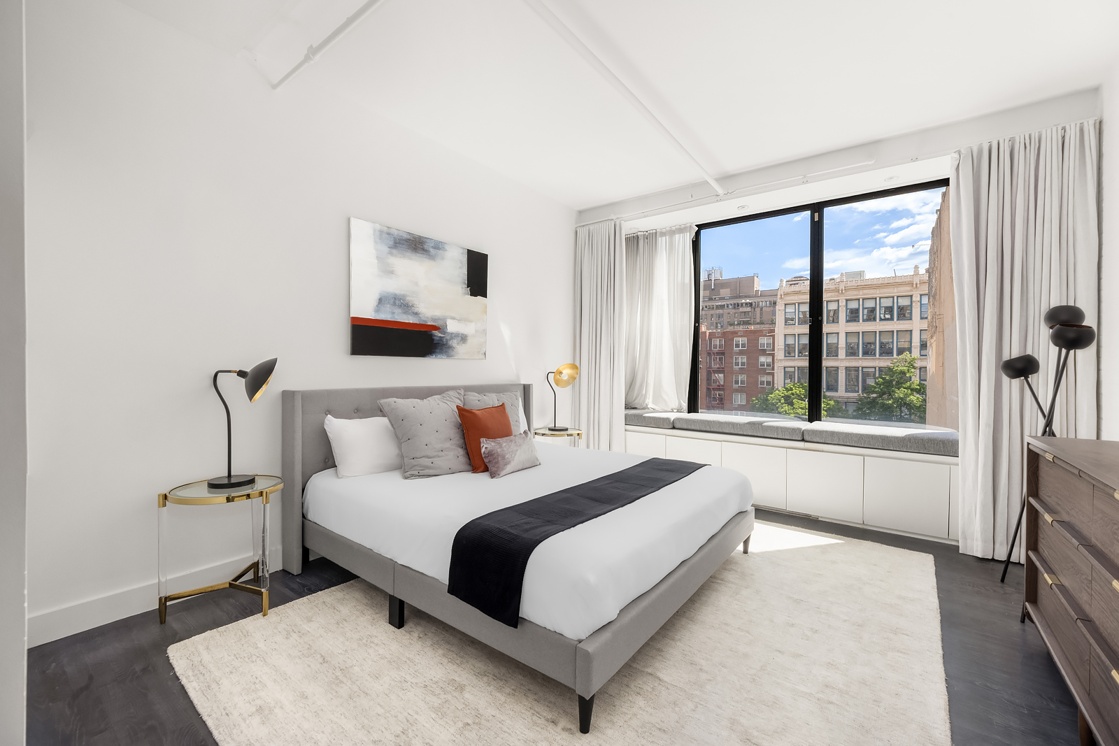 36 West 15th Street, Unit 4 Manhattan, NY 10011 - Photo 13 of 21 a spacious bedroom with a large bed and a large window
