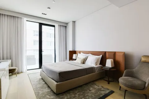 a bedroom with a bed and a couch