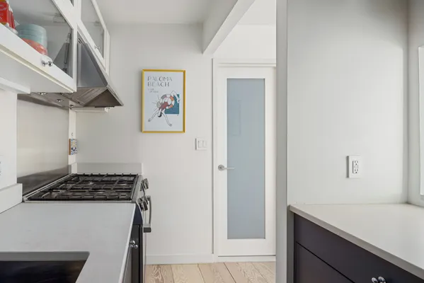a view of kitchen cabinetry and stove