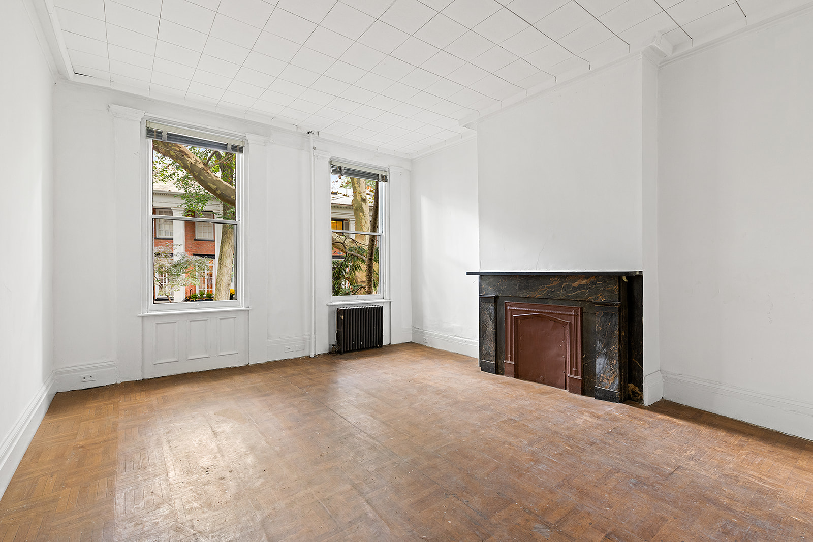 46 Willow Place Brooklyn, NY 11201 - Photo 4 of 31 an empty room with windows and fireplace