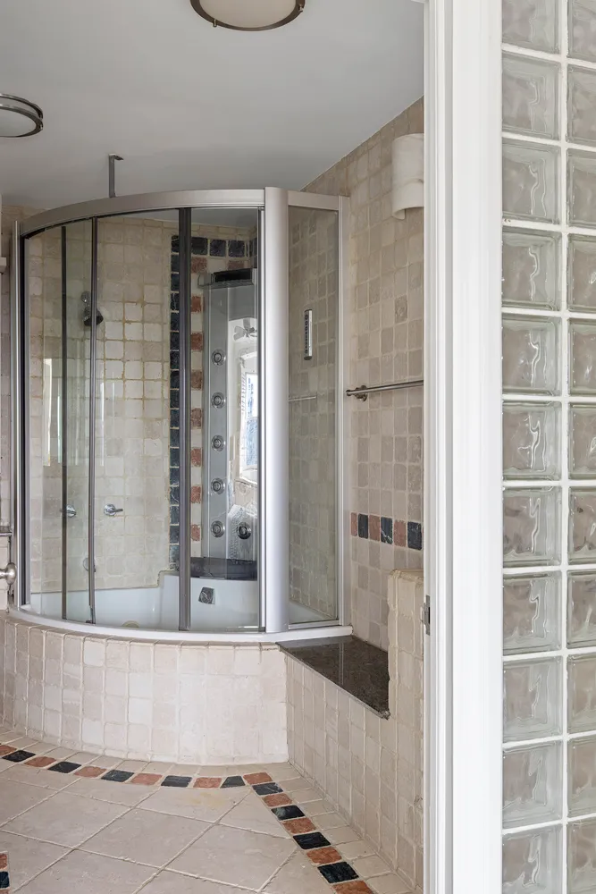 a bathroom with a bathtub and a shower