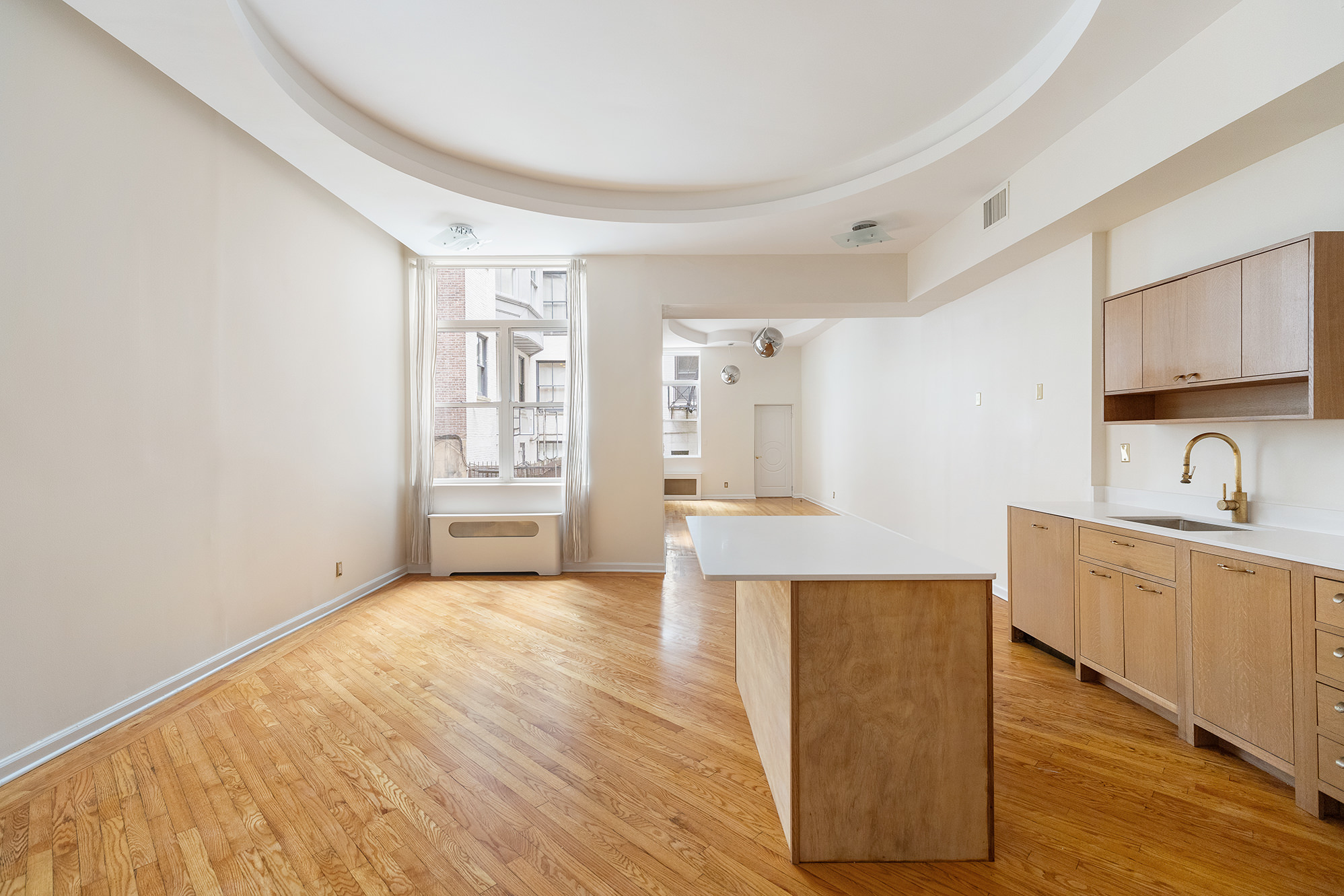 23 East 81st Street, Unit 1 Manhattan, NY 10028 - Photo 14 of 23 a view of a kitchen with wooden floor