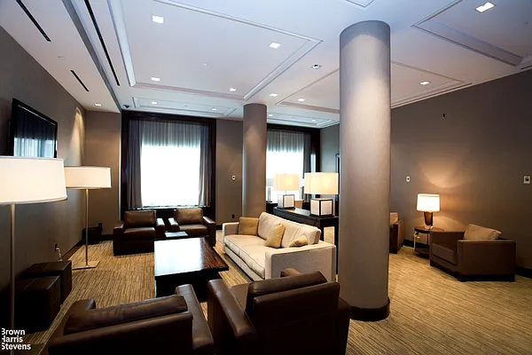 100 Riverside Boulevard, Unit 21A Manhattan, NY 10069 - Photo 18 of 22 a living room with furniture and a flat screen tv