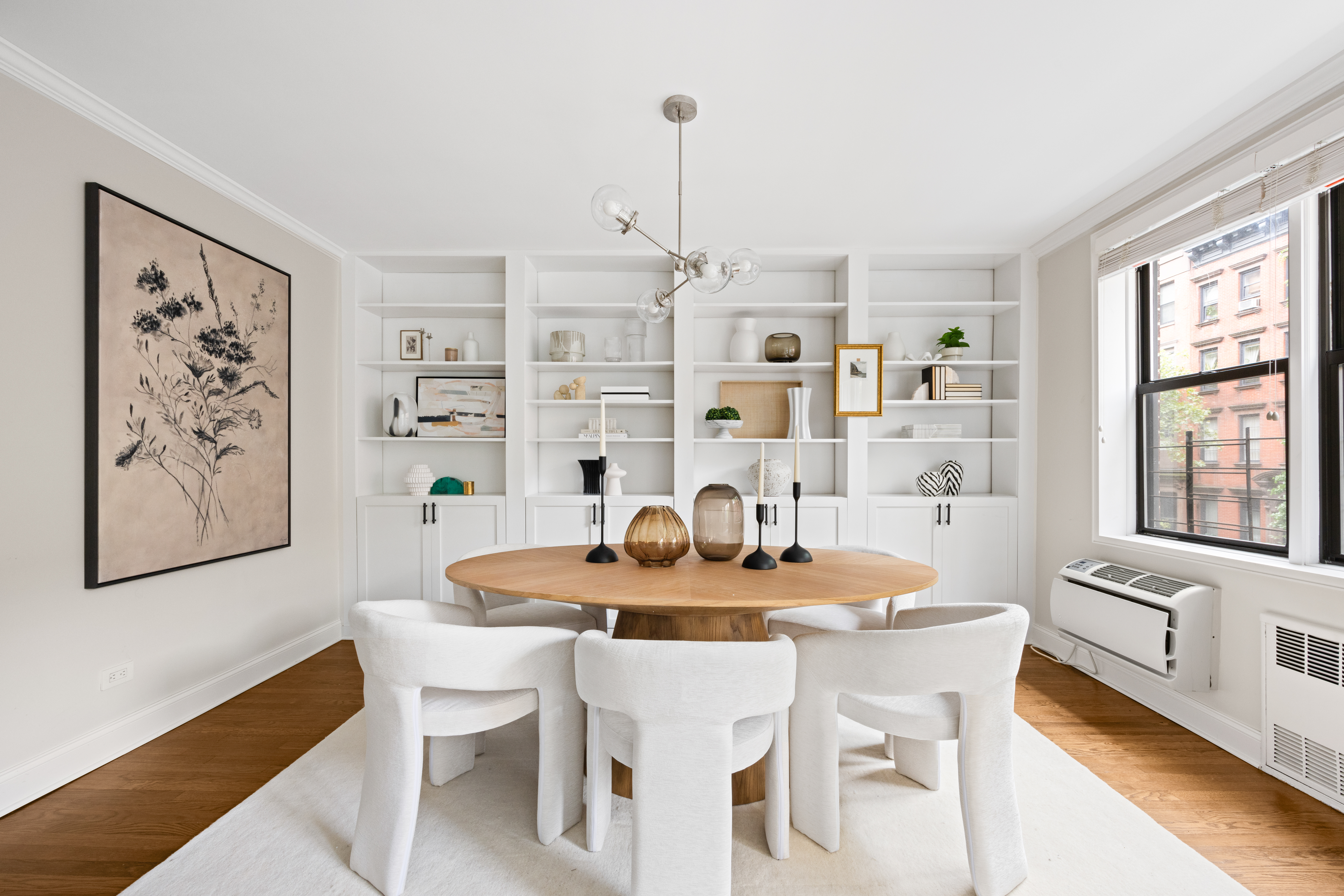211 East 18th Street, Unit 2O Manhattan, NY 10003 - Photo 4 of 14 a dining room with furniture and window