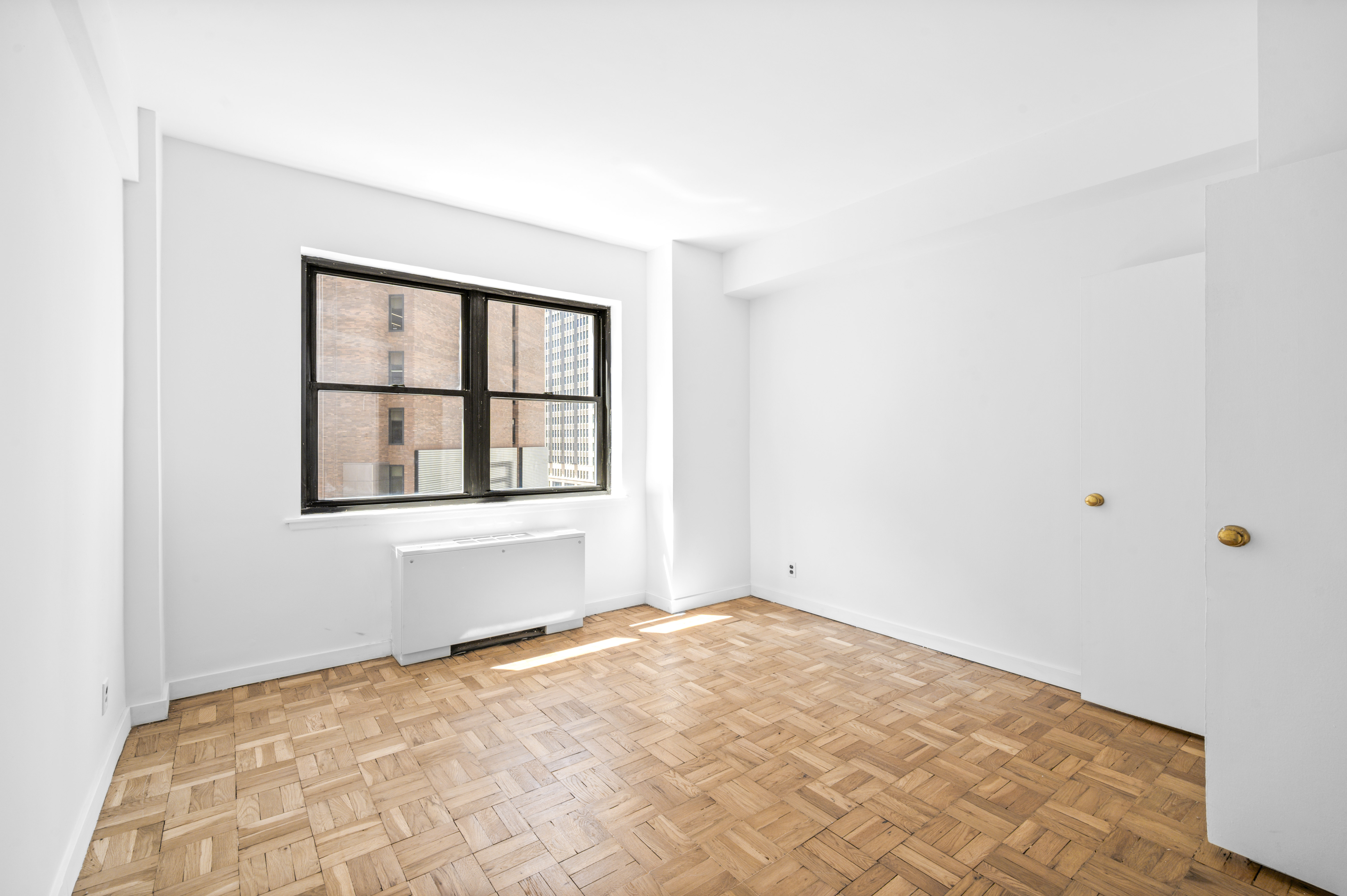 7 Park Avenue, Unit 66 Manhattan, NY 10016 - Photo 6 of 11 a view of empty room with window