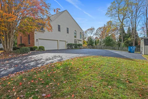 a swimming pool with outdoor seating and yard