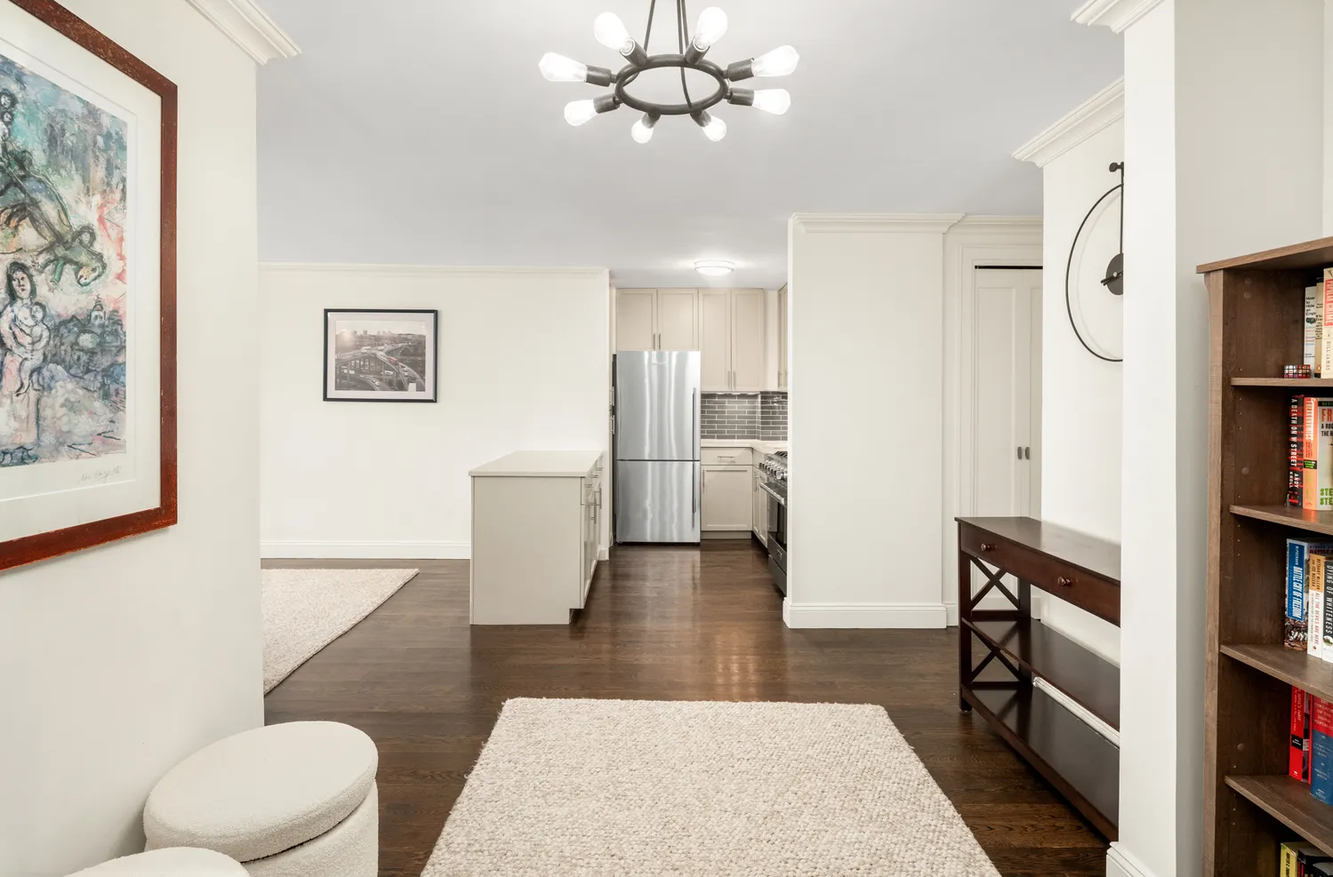 a living room with furniture and a rug
