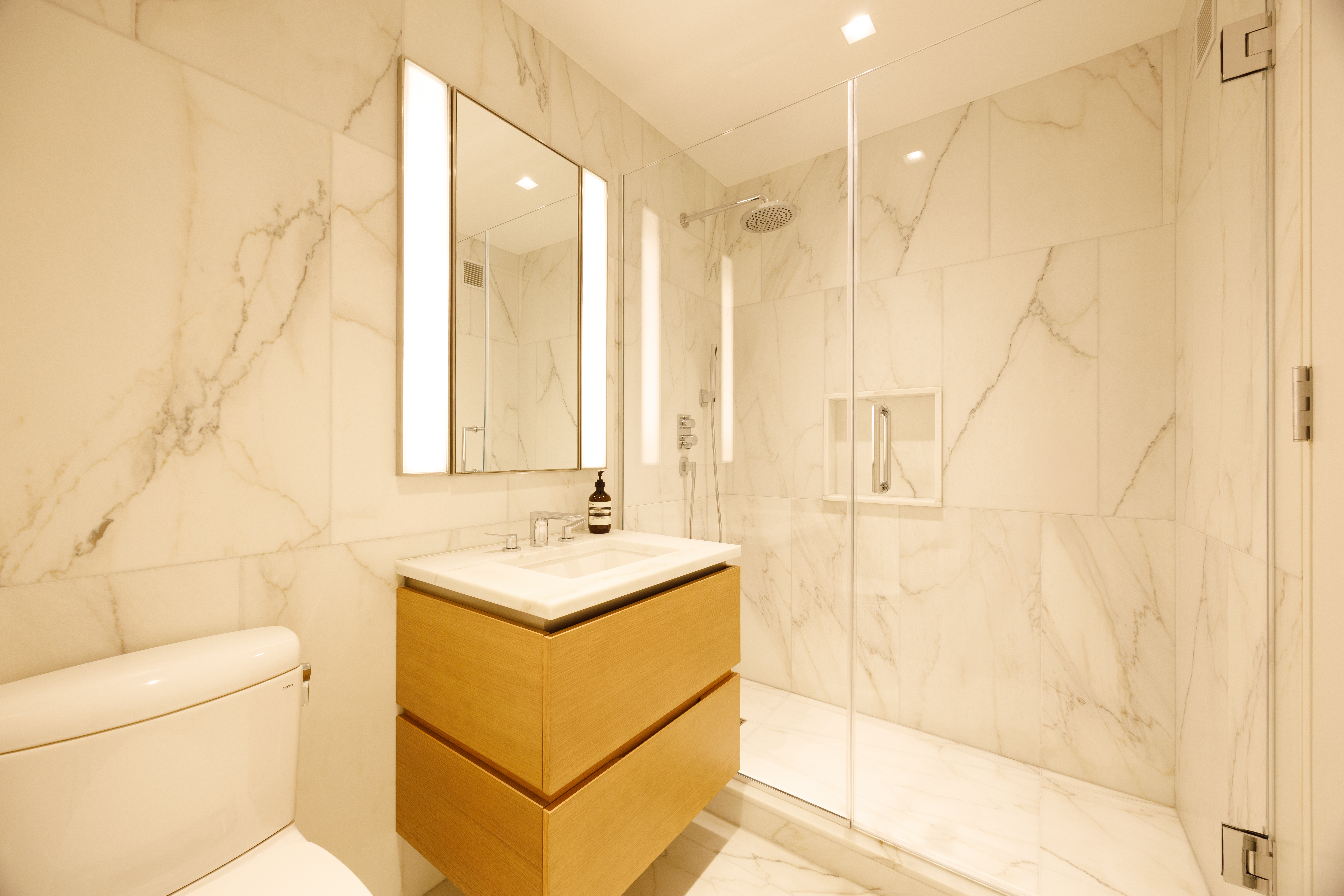 450 Washington Street, Unit 215 Manhattan, NY 10013 - Photo 6 of 7 a bathroom with a sink a toilet and shower