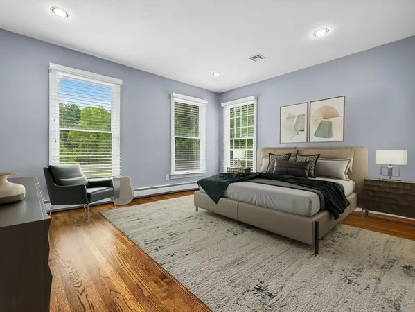 a spacious bedroom with a bed and glass window