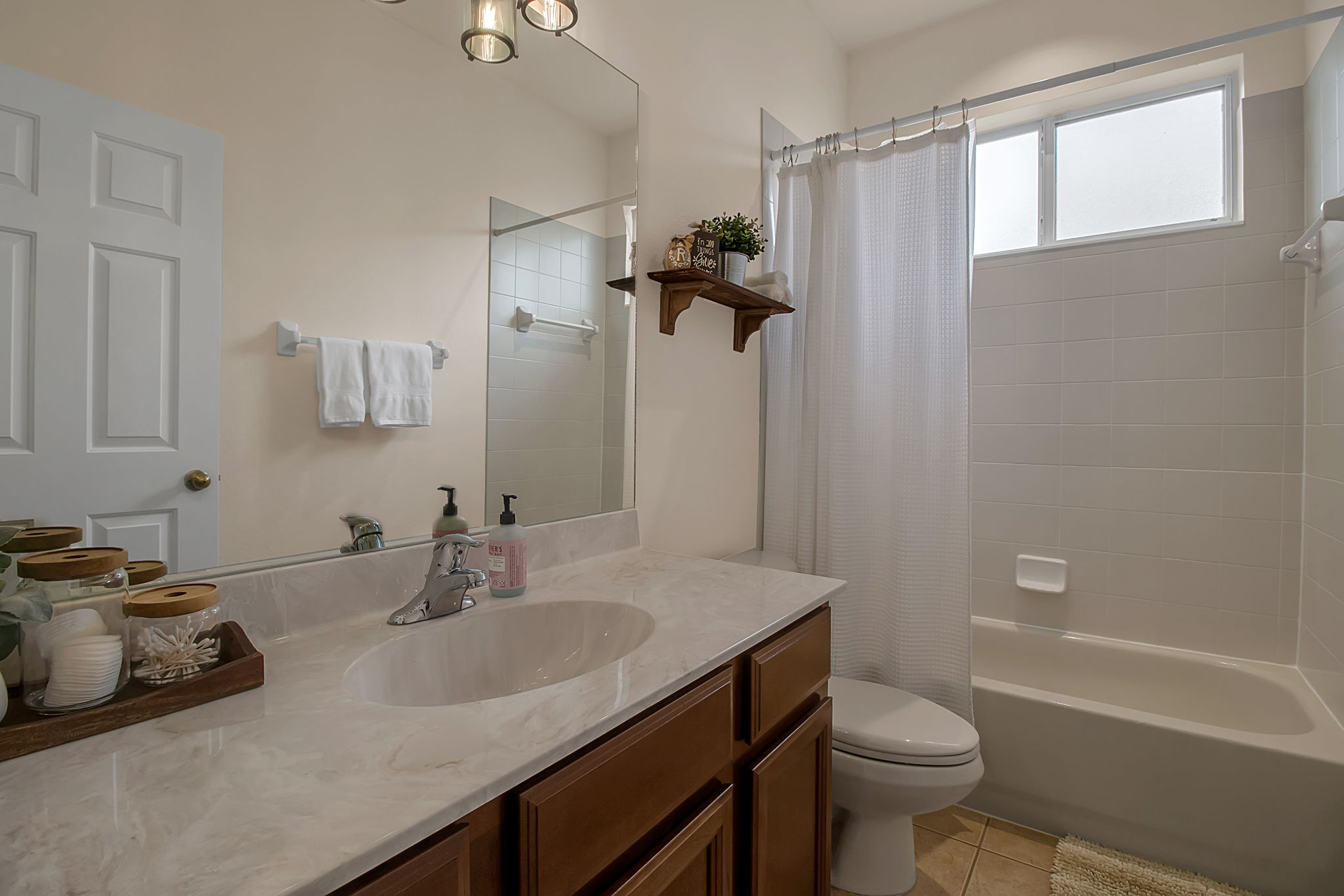6106 34th Court East Bradenton, FL 34203 - Photo 45 of 69 a bathroom with a sink toilet a tub and shower