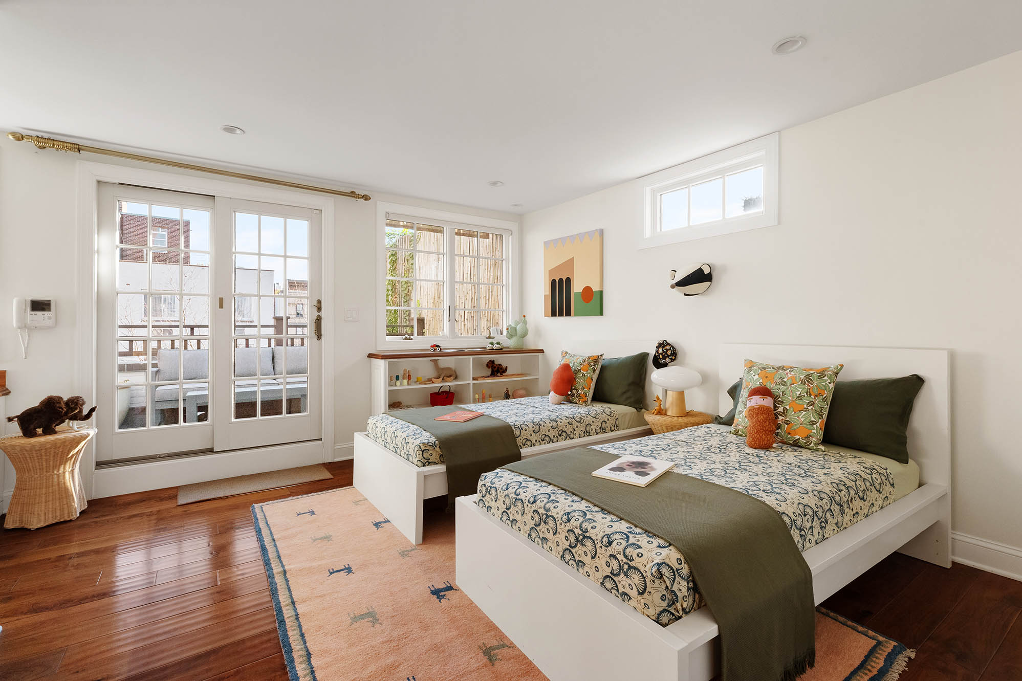 12 Leroy Street Manhattan, NY 10014 - Photo 13 of 20 a bedroom with two beds and a large window