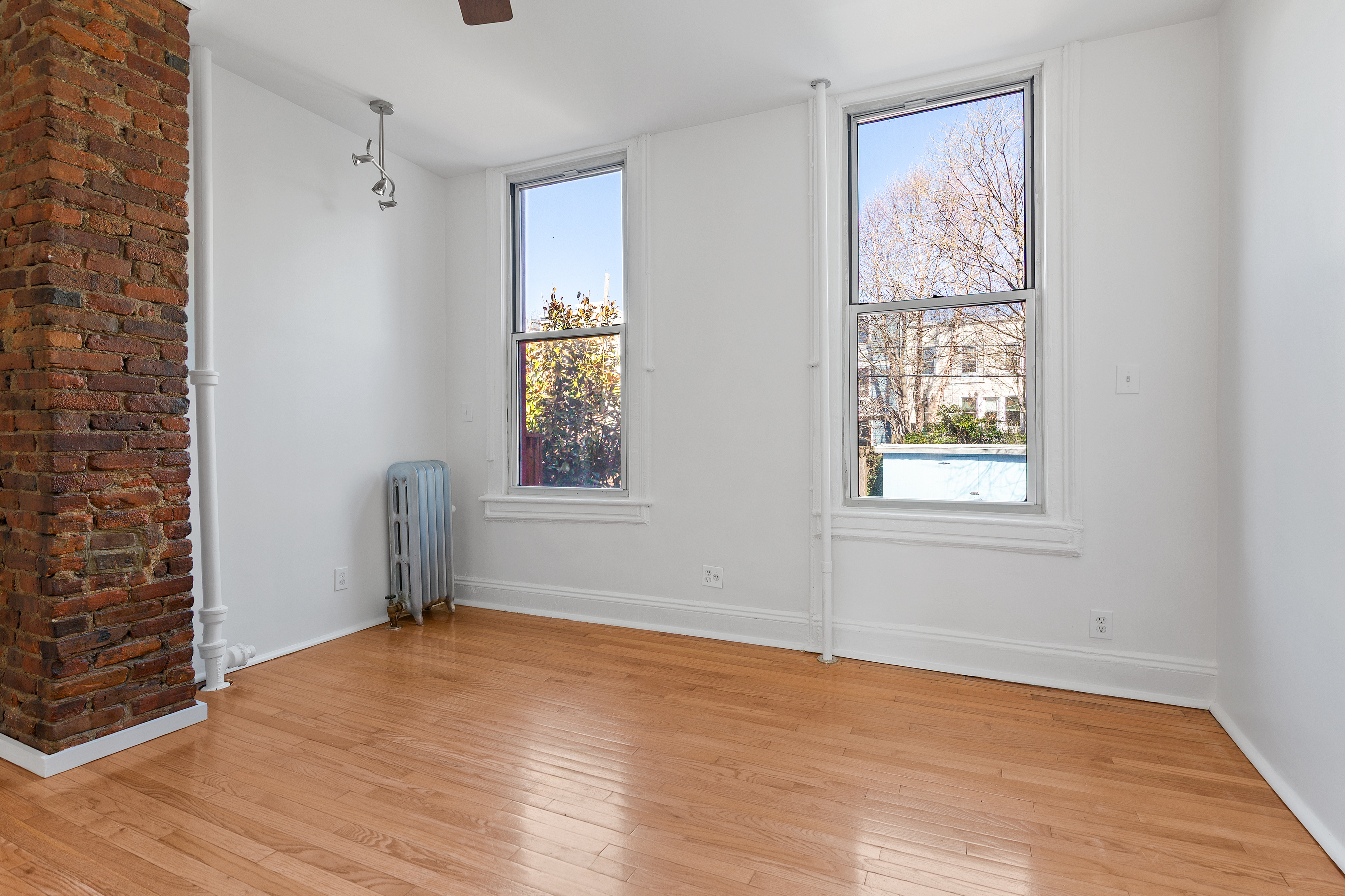 537 18th Street Brooklyn, NY 11215 - Photo 5 of 12 an empty room with windows and closet