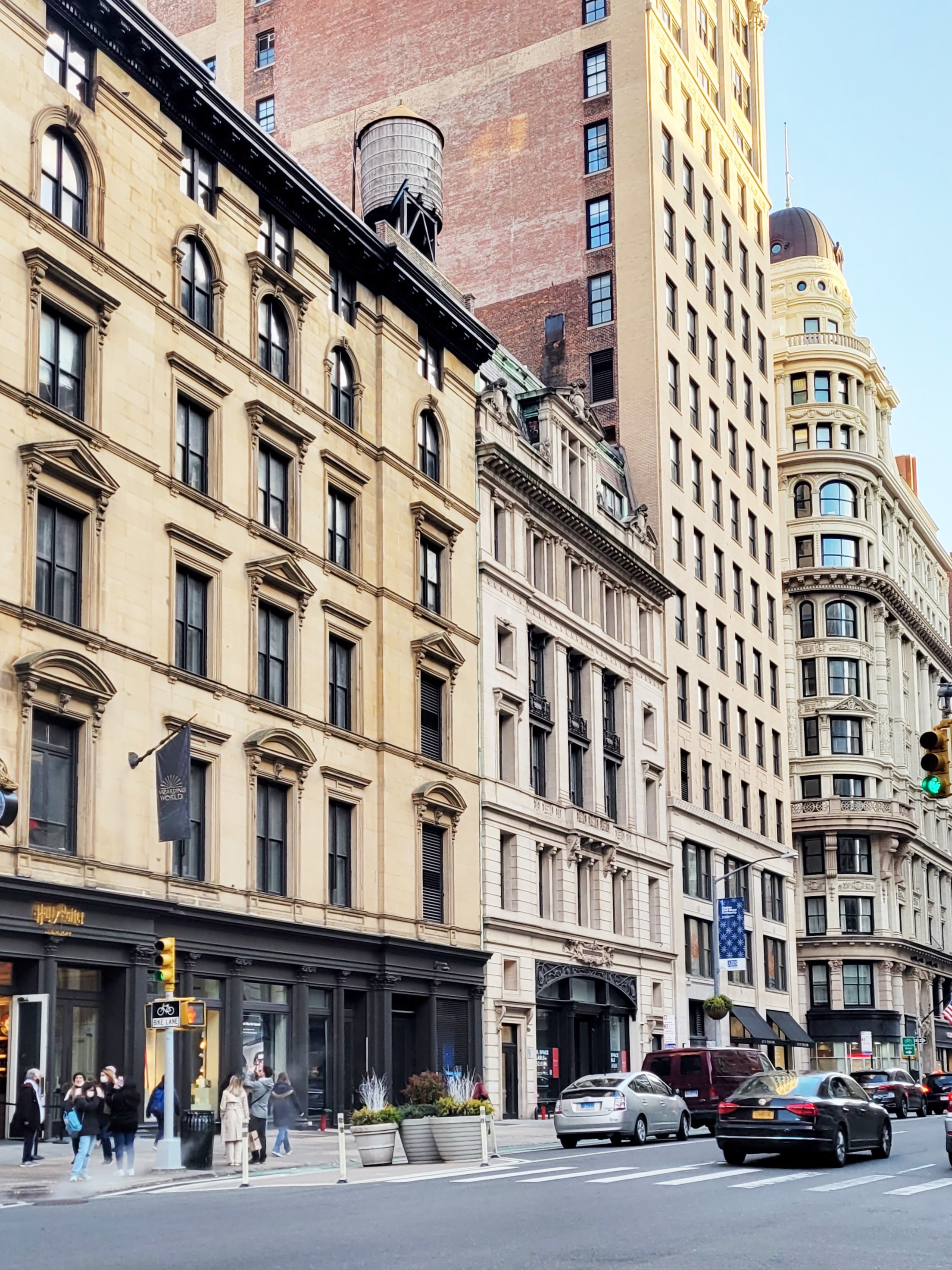 172 5th Avenue, Unit 2F Manhattan, NY 10010 - Photo 10 of 10 a front view of a building with lot of cars and trees