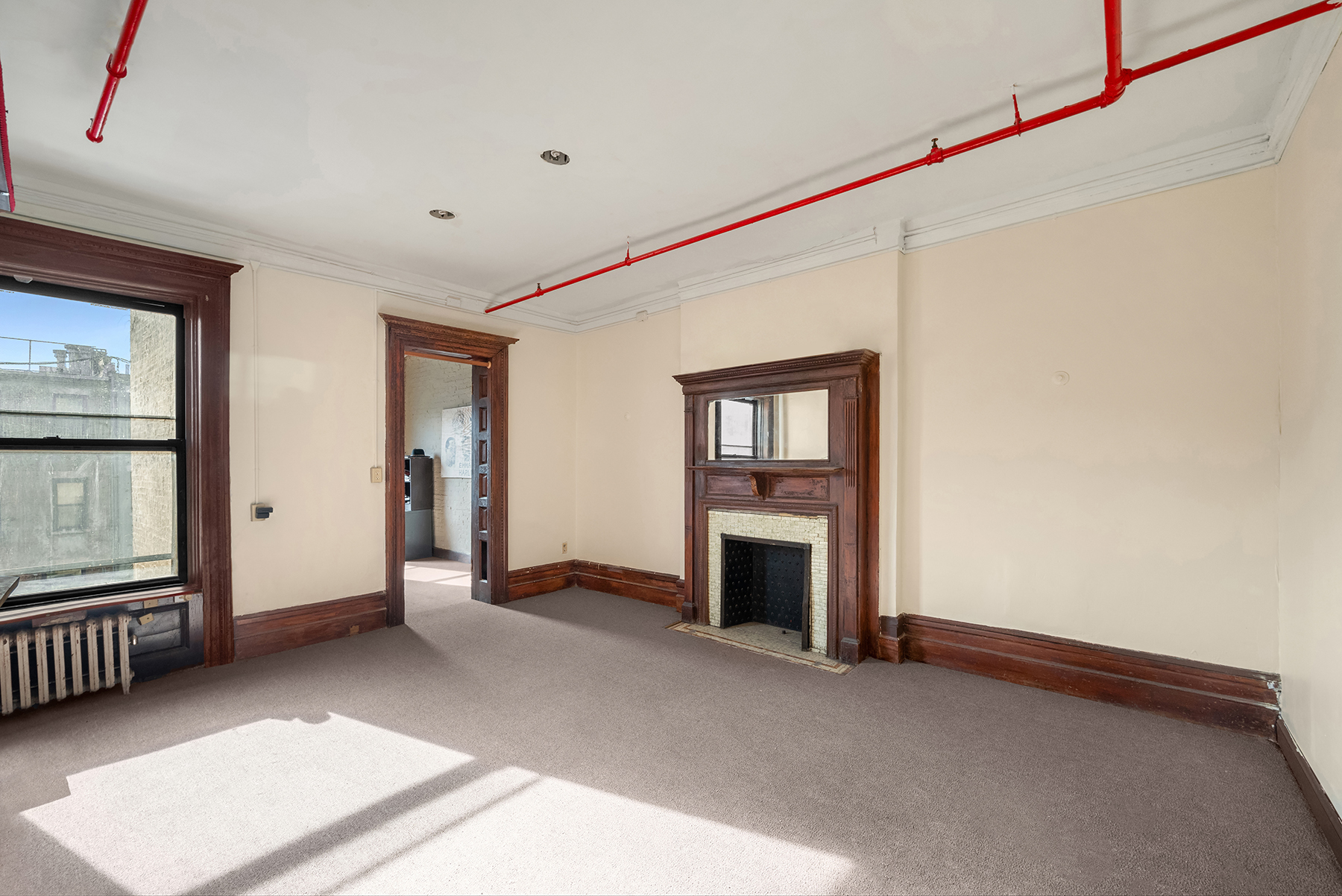 160 West 120th Street Manhattan, NY 10027 - Photo 4 of 9 a view of livingroom with furniture and windows