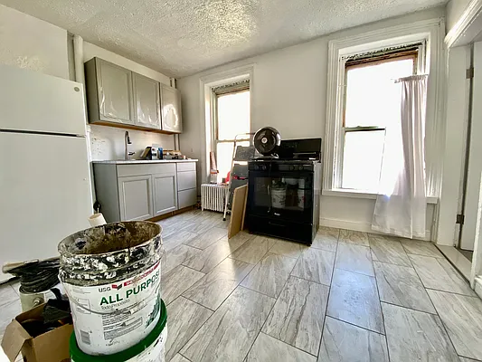 591 Vanderbilt Avenue, Unit 4 Brooklyn, NY 11238 - Photo 4 of 10 a kitchen with a cabinets and window