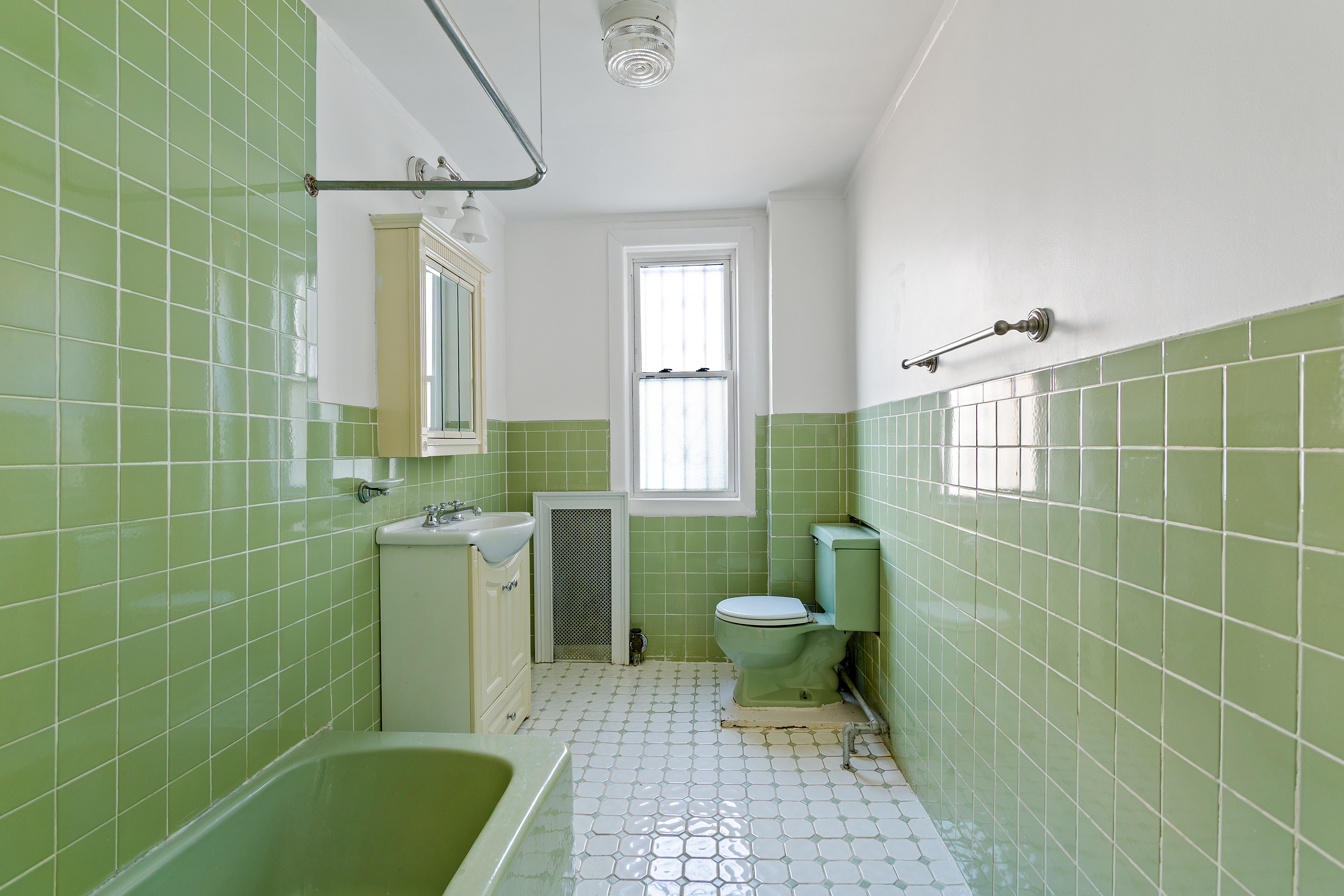 537 18th Street Brooklyn, NY 11215 - Photo 6 of 12 a bathroom with a sink toilet and tub