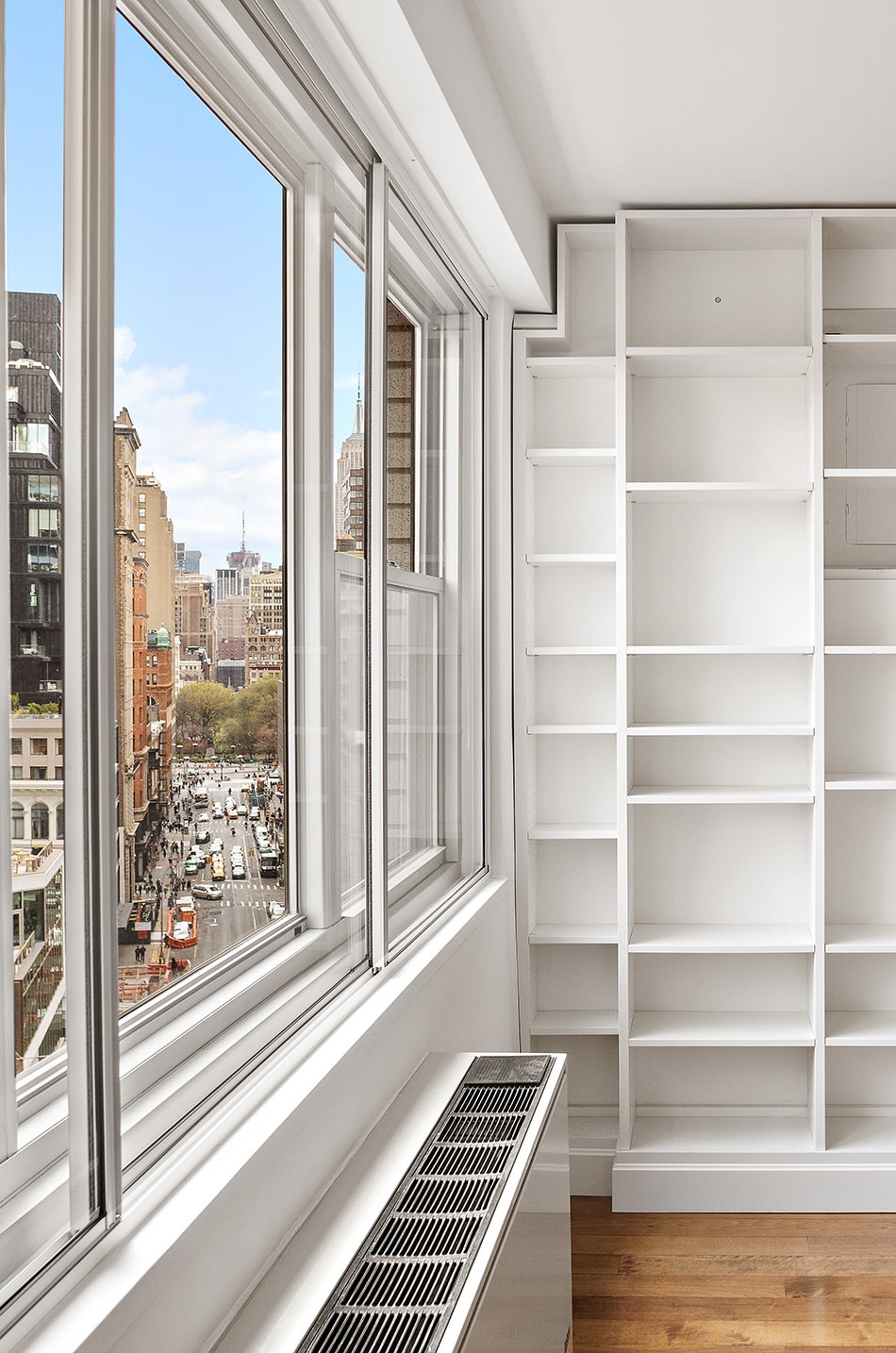 70 East 10th Street, Unit 14P Manhattan, NY 10003 - Photo 3 of 8 a view of a living room and wooden floor