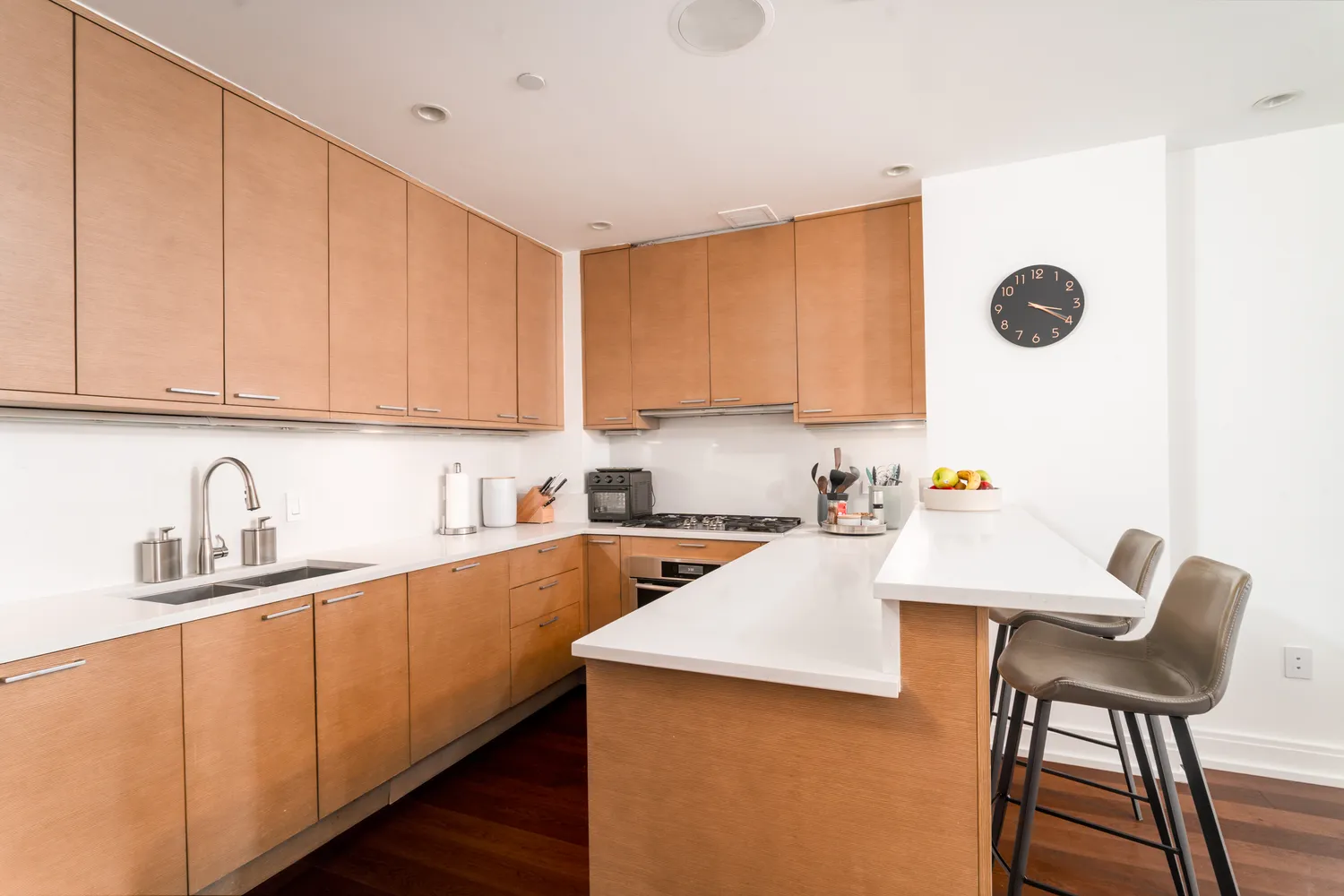 a kitchen with a sink cabinets and window