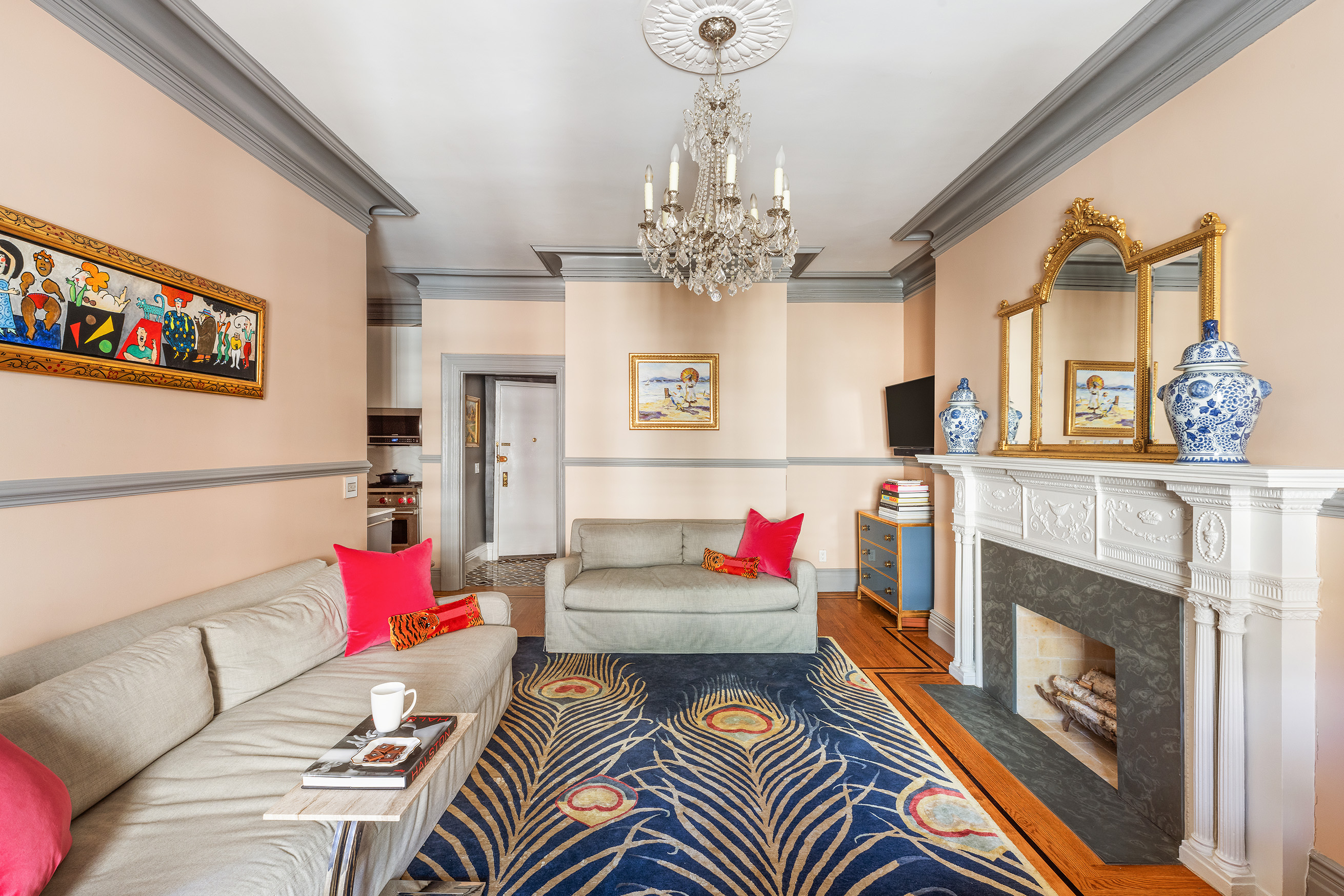 6 East 76th Street, Unit 3F Manhattan, NY 10021 - Photo 2 of 11 a living room with furniture and a fireplace