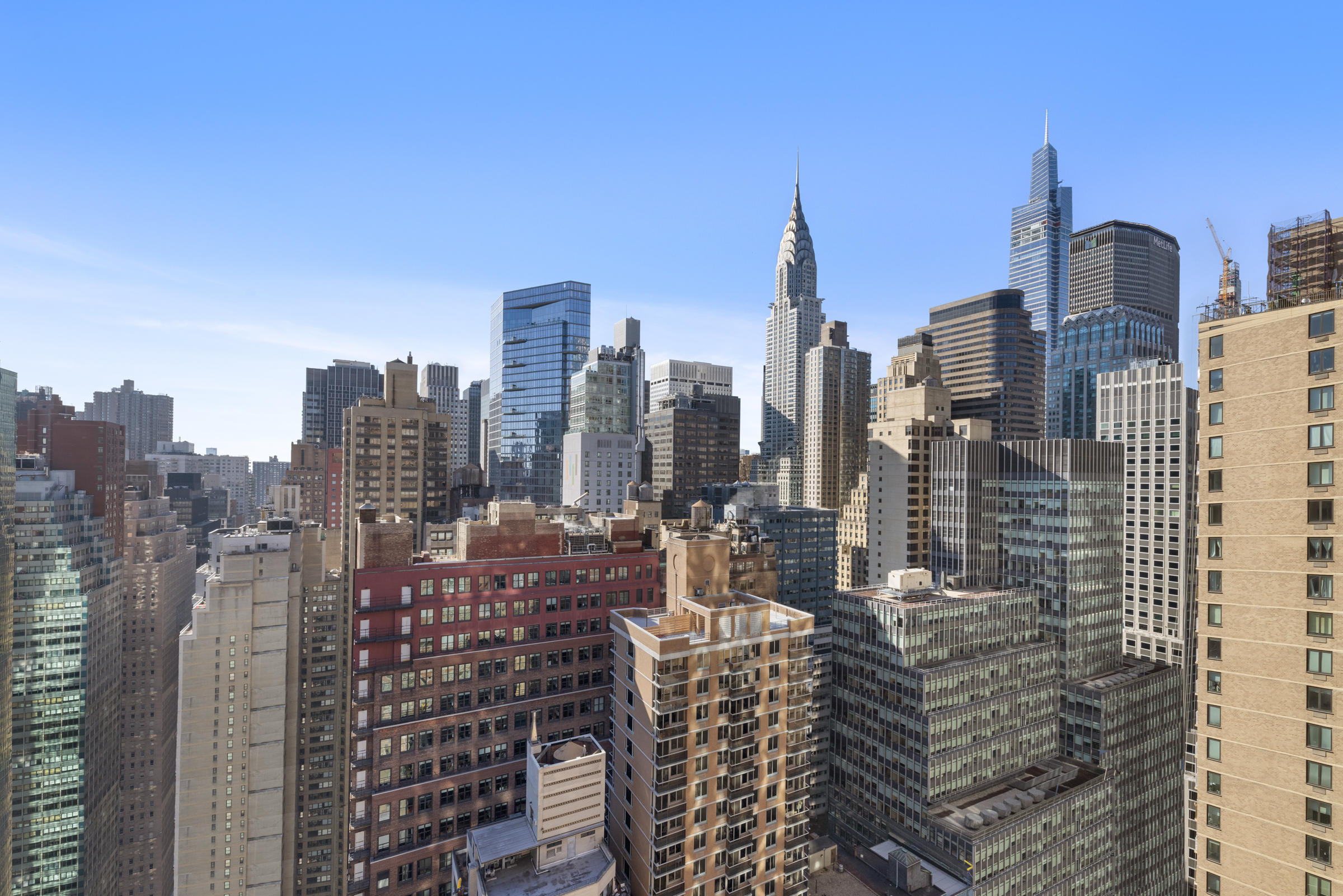 240 East 47th Street, Unit 27A Manhattan, NY 10017 - Photo 2 of 9 a view of city with tall buildings