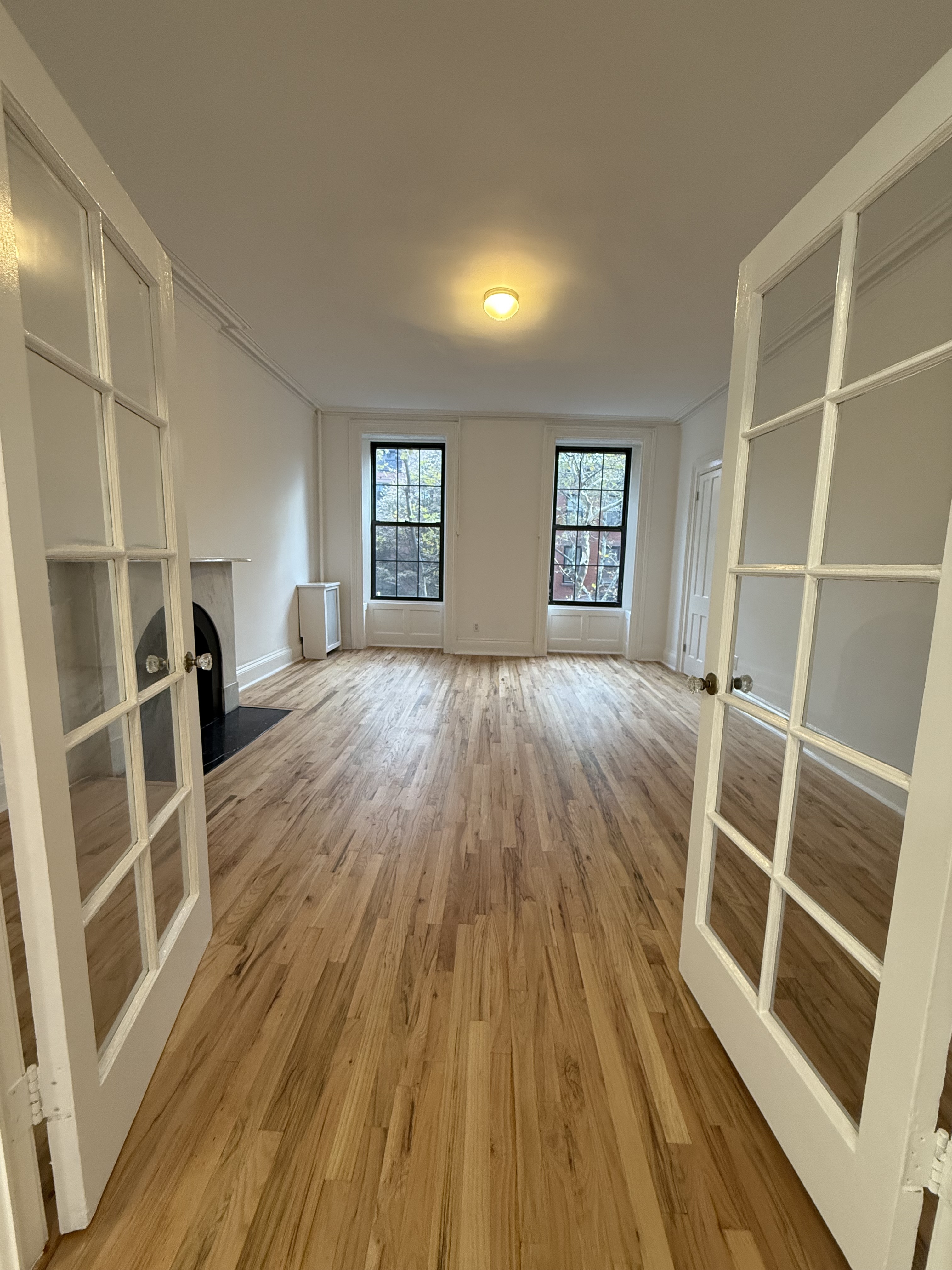 141 Summit Street, Unit 3 Brooklyn, NY 11231 - Photo 15 of 17 wooden floor in an empty room with a window