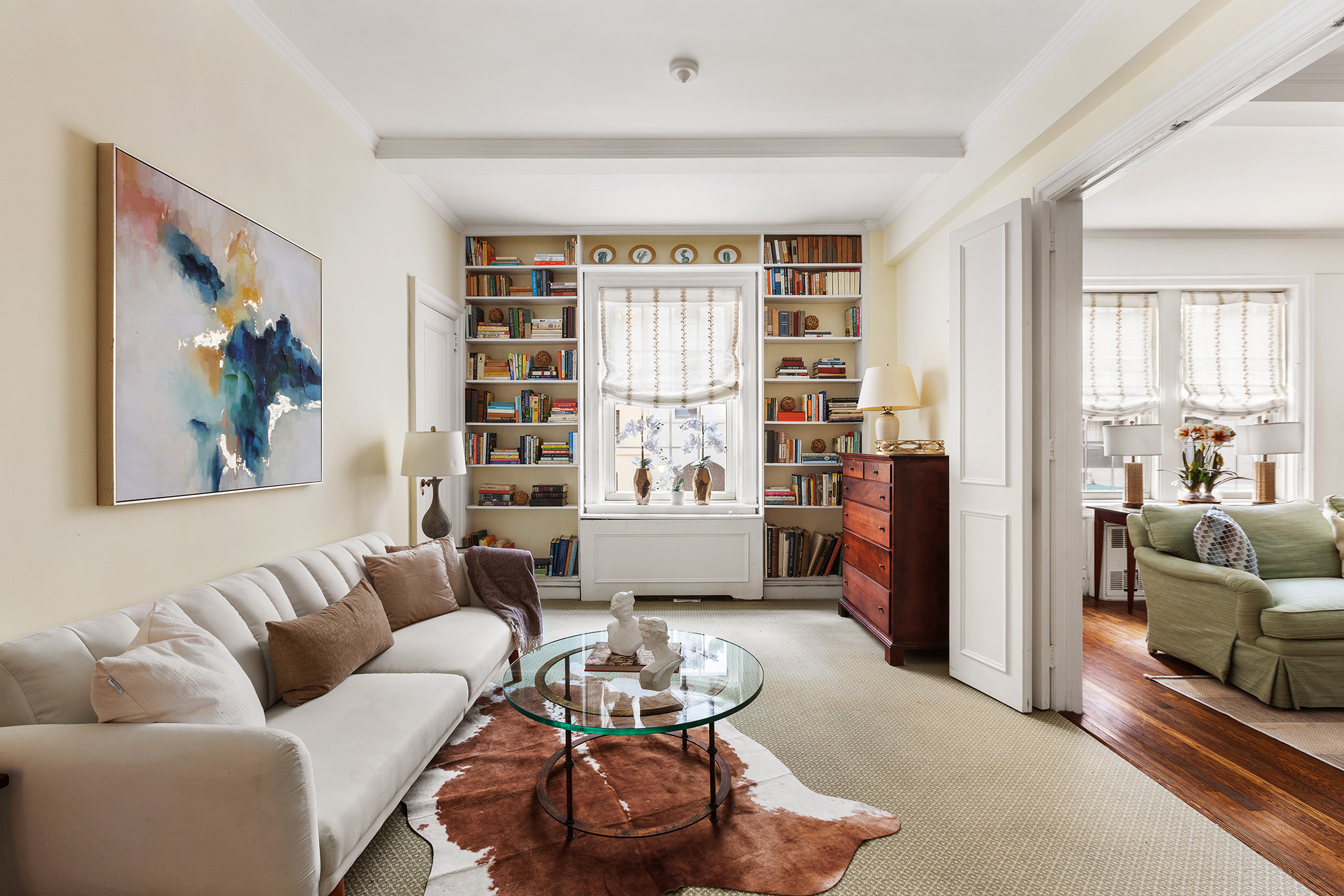 125 East 63rd Street, Unit 2B Manhattan, NY 10065 - Photo 5 of 12 a living room with furniture and a large window