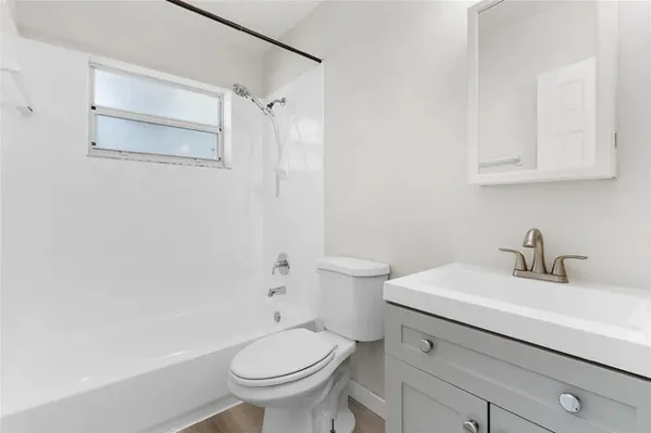 a bathroom with a sink toilet and vanity
