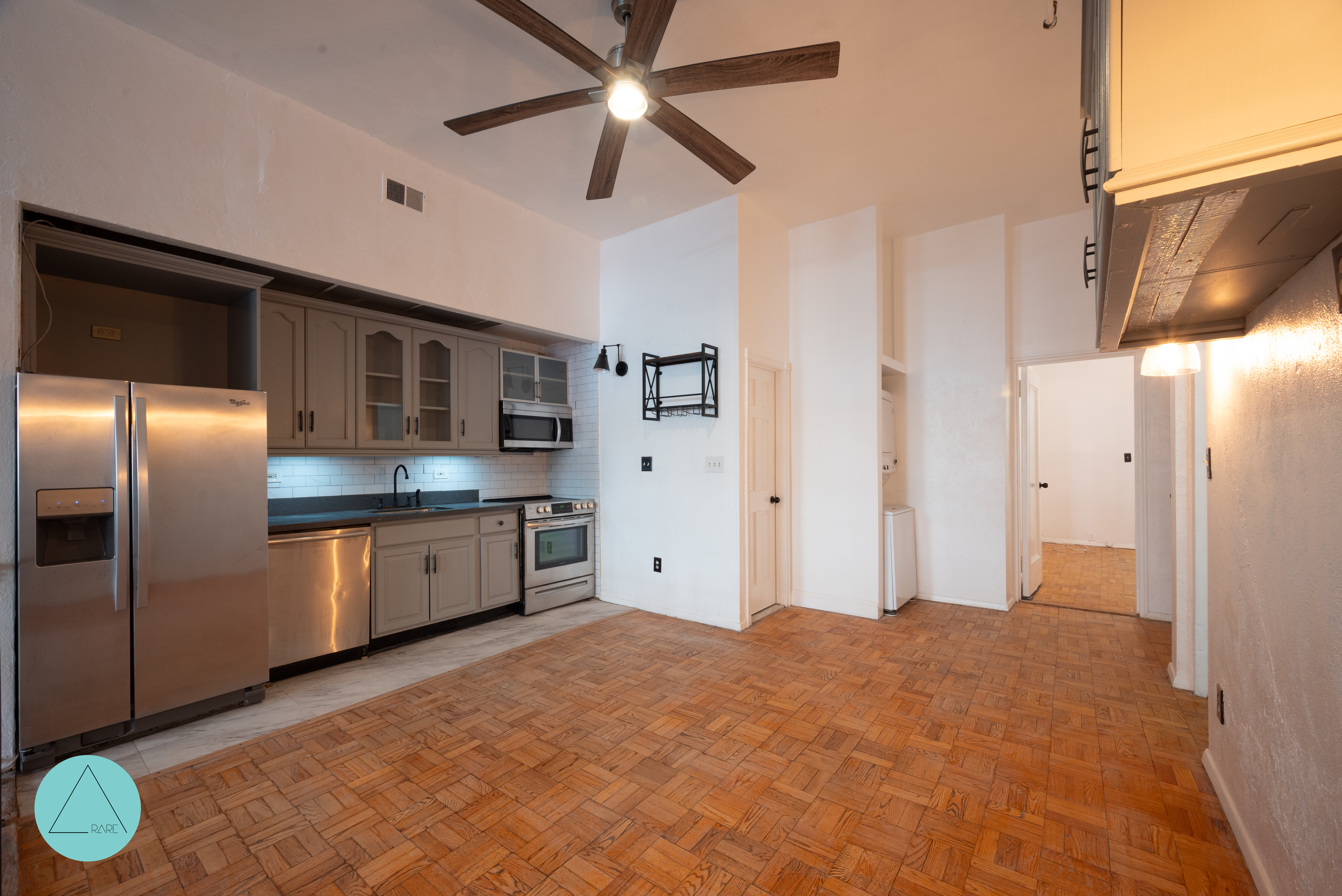 862 West End Avenue, Unit GARDEN Manhattan, NY 10025 - Photo 12 of 13 a large kitchen with stainless steel appliances kitchen island granite countertop a refrigerator a stove and a sink with granite countertops