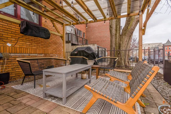 a view of a backyard with sitting area