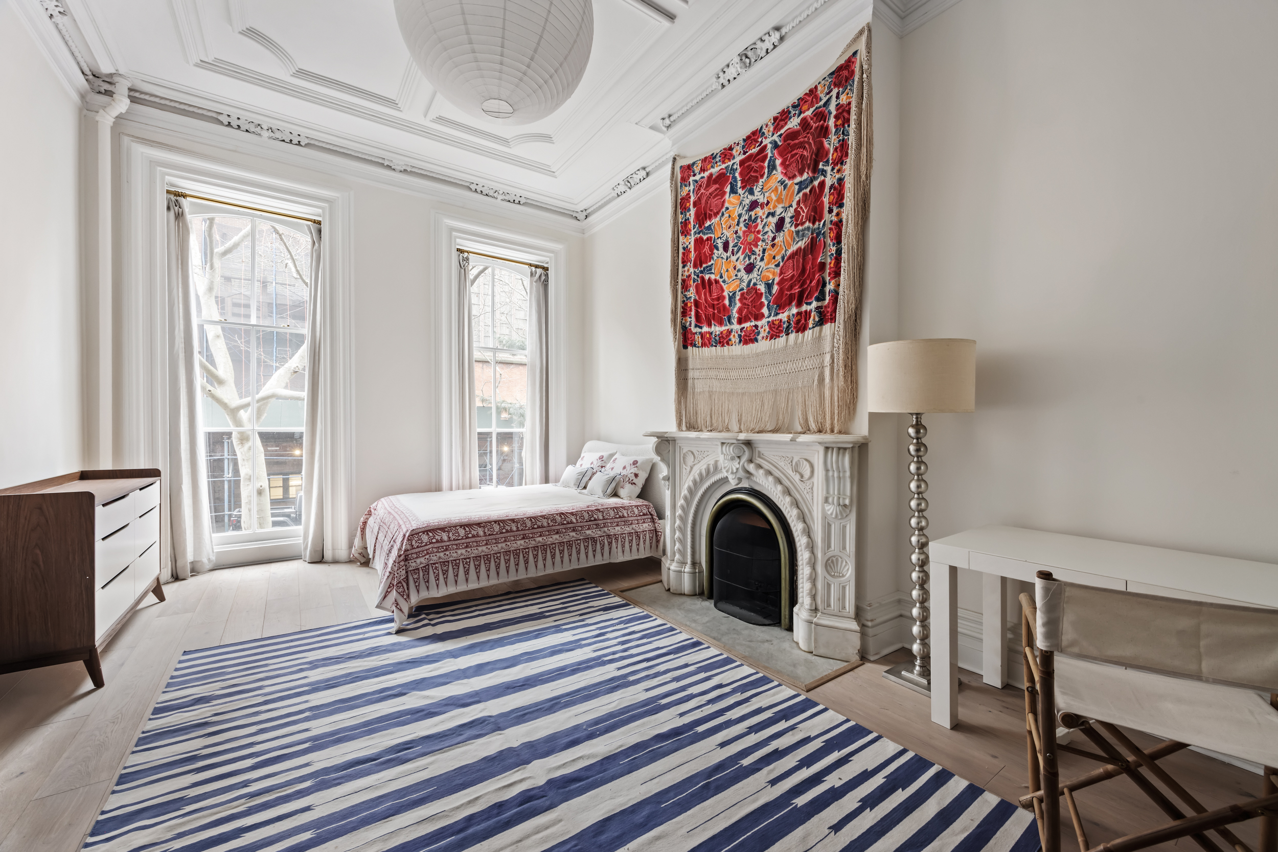 427 West 21st Street, Unit PARLOR Manhattan, NY 10011 - Photo 13 of 19 a spacious bedroom with a bed and a couch