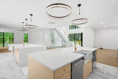 a kitchen with a table and chairs