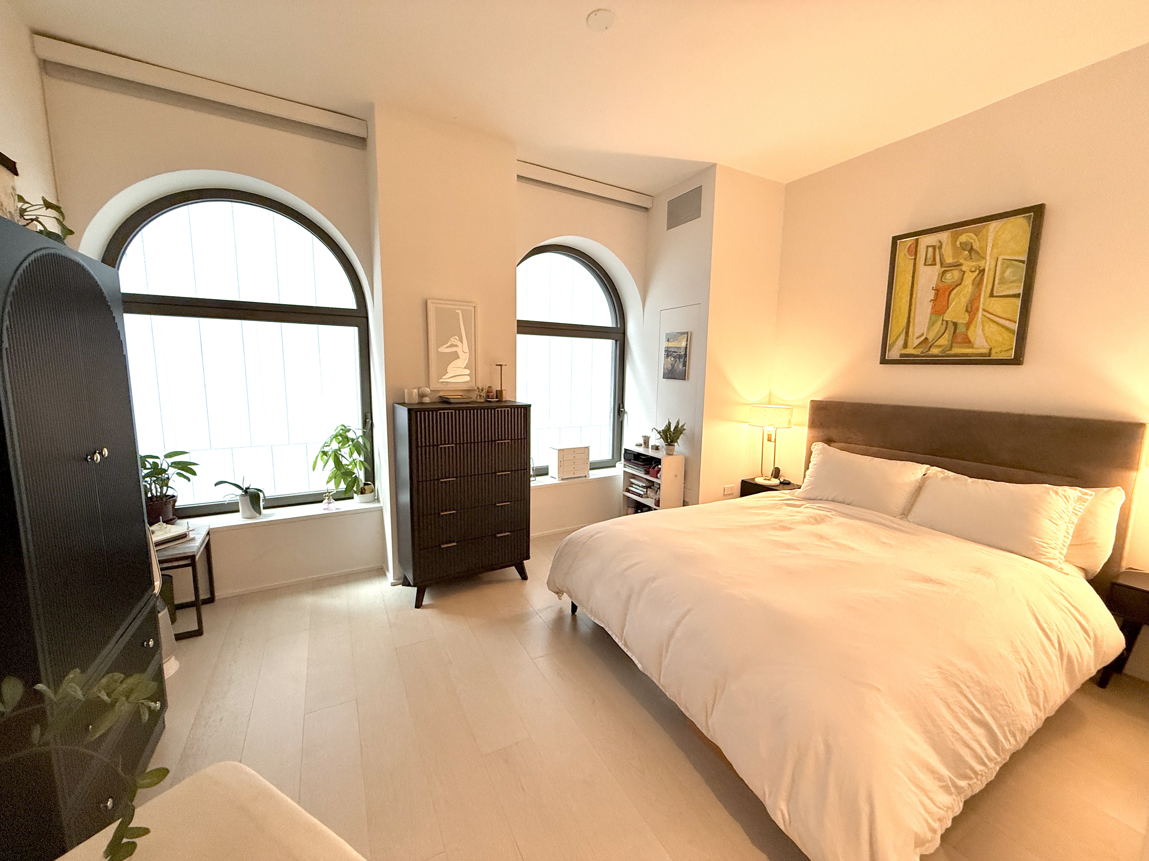 130 William Street, Unit 9E Manhattan, NY 10038 - Photo 2 of 16 a spacious bedroom with bed and a large window