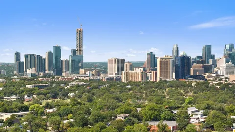 a view of a city with tall buildings in the background