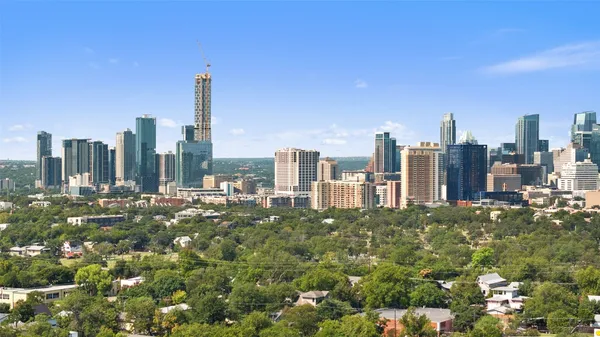 a view of a city with tall buildings in the background