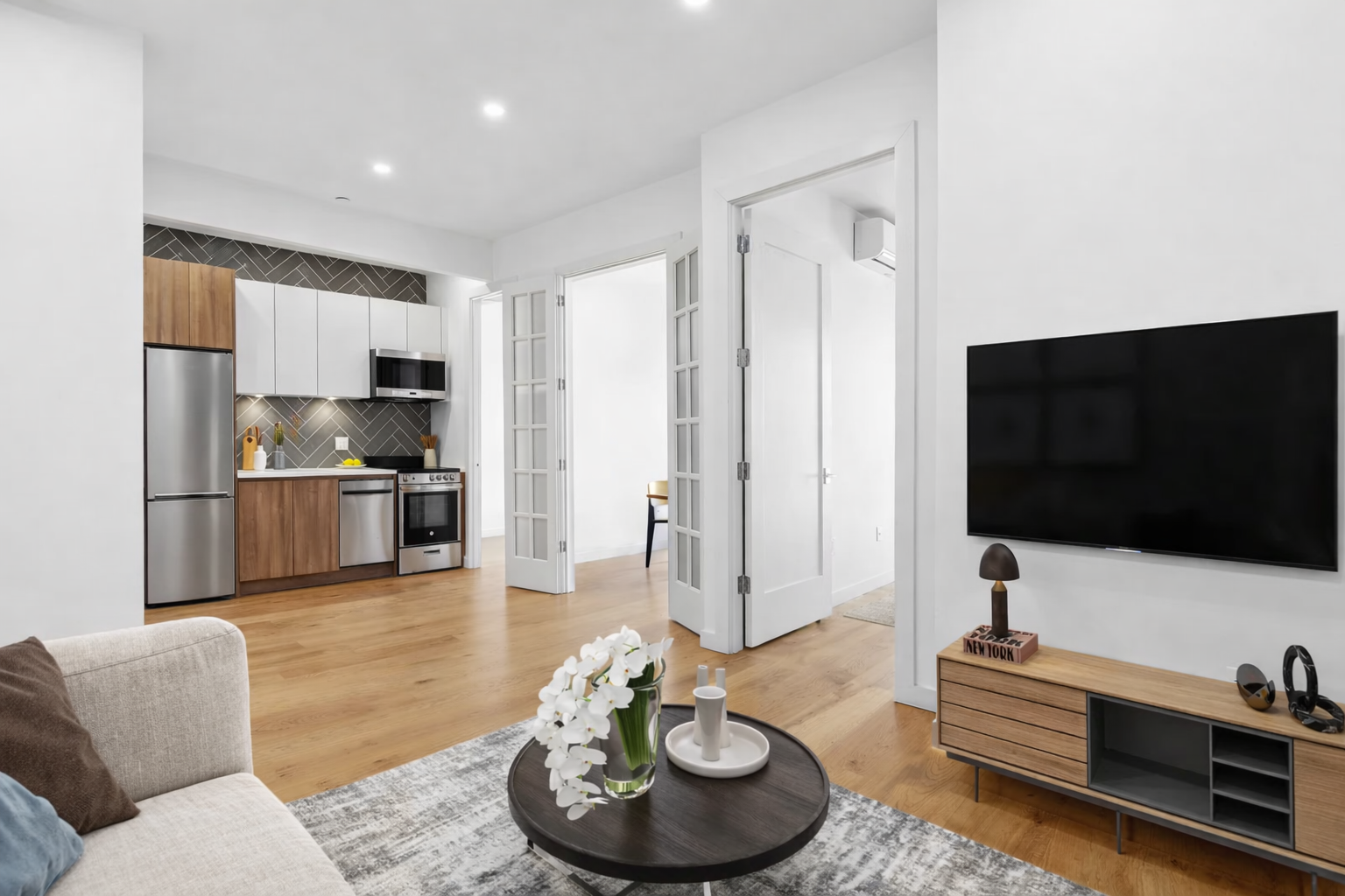 a living room with furniture and a flat screen tv