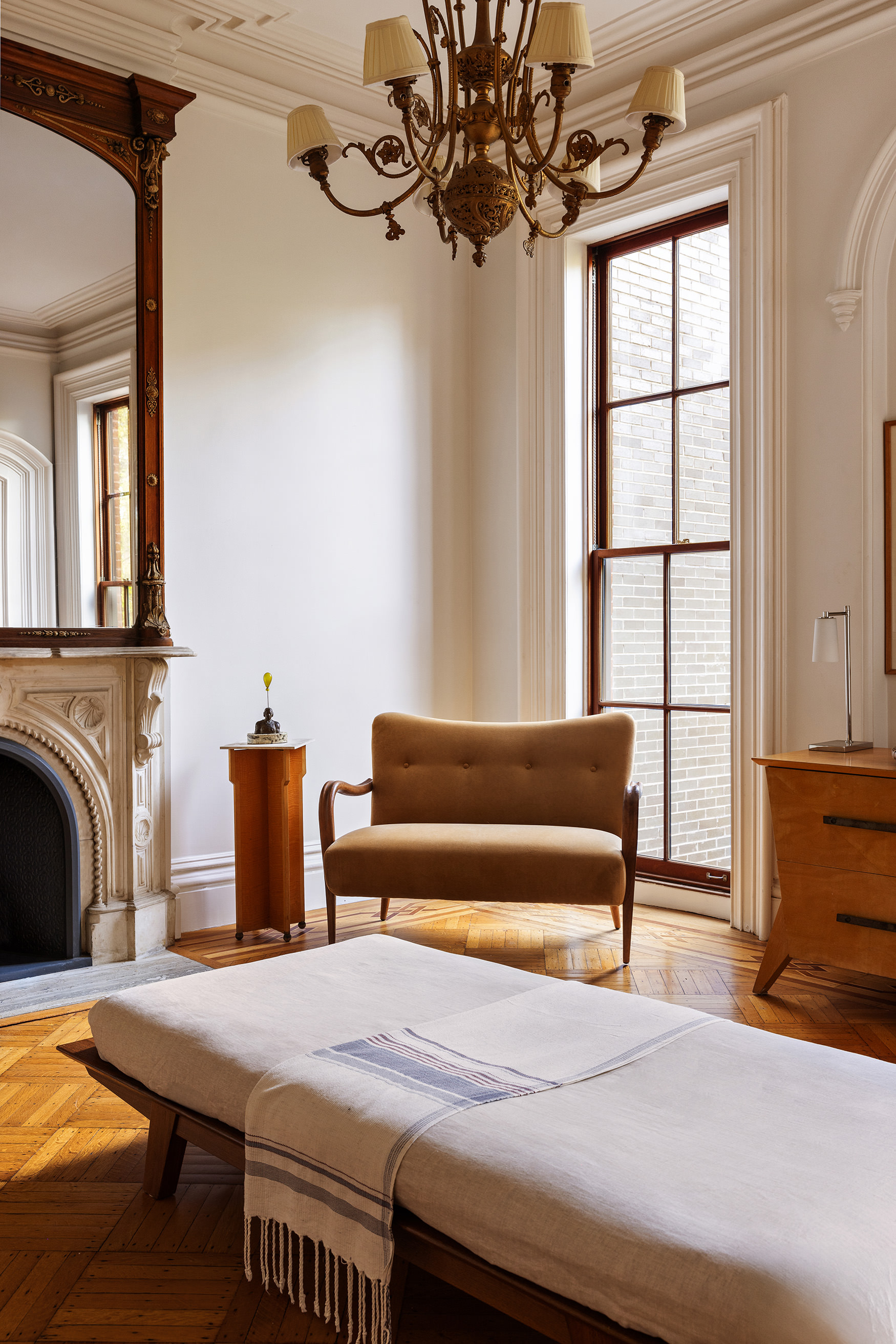 177 Prospect Place Brooklyn, NY 11238 - Photo 9 of 42 a bedroom with a bed and a chandelier