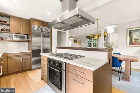 a kitchen with a stove and a refrigerator