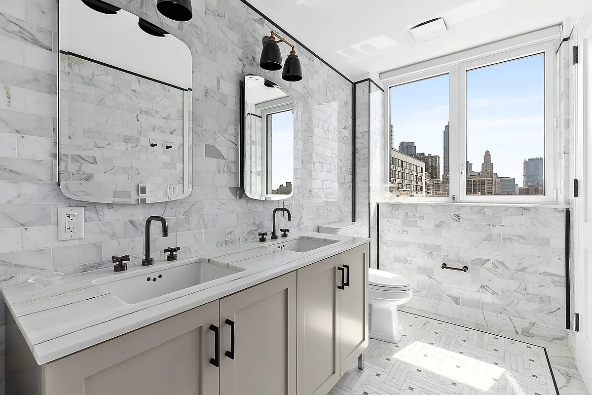 265 State Street, Unit 901 Brooklyn, NY 11201 - Photo 6 of 10 a bathroom with a sink and a mirror