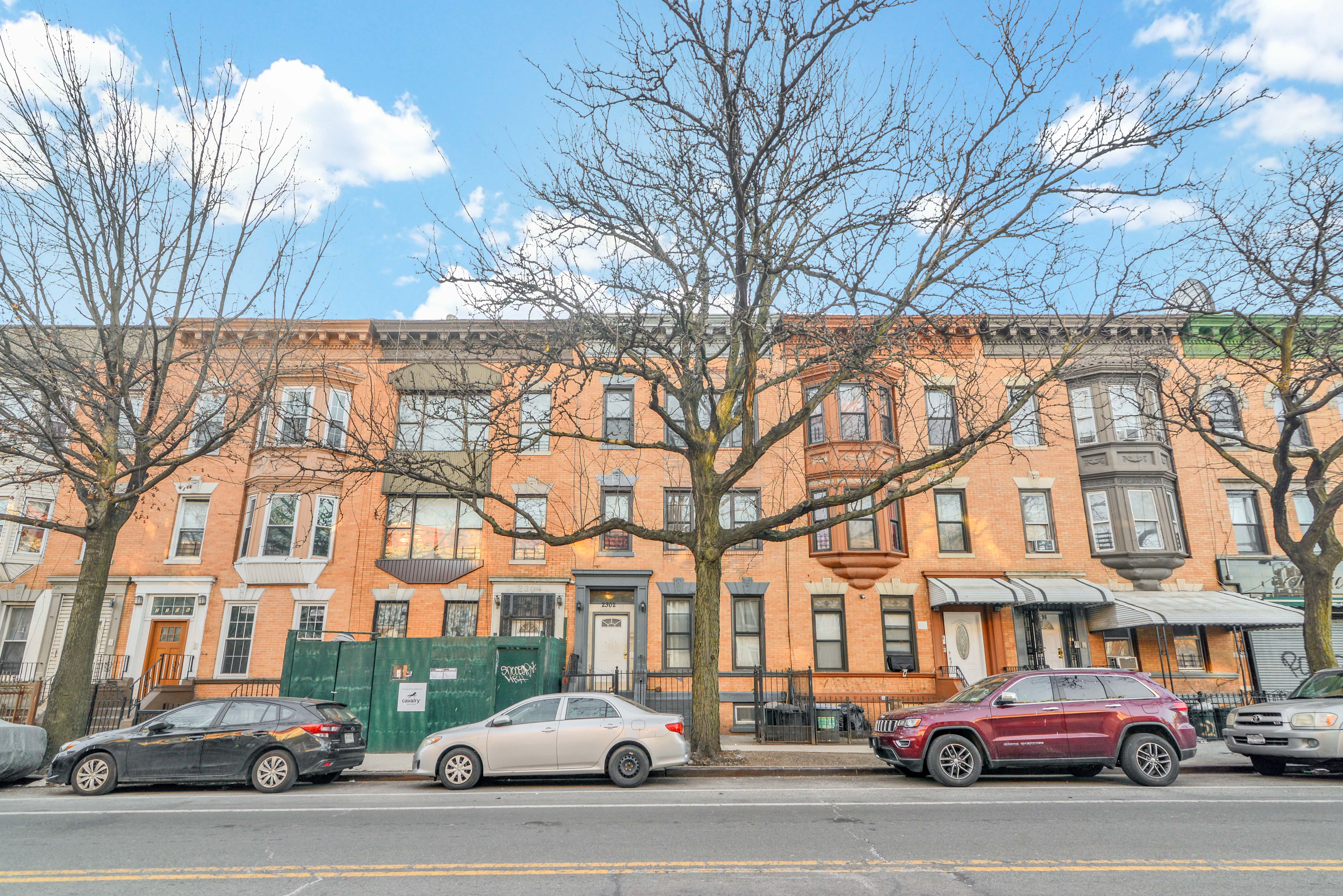2302 Bedford Avenue, Unit 3 Brooklyn, NY 11226 - Photo 2 of 25 a city street lined with buildings and cars