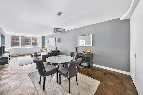 77 7th Avenue, Unit 9E Manhattan, NY 10011 - Photo 2 of 9 a view of a dining room with furniture