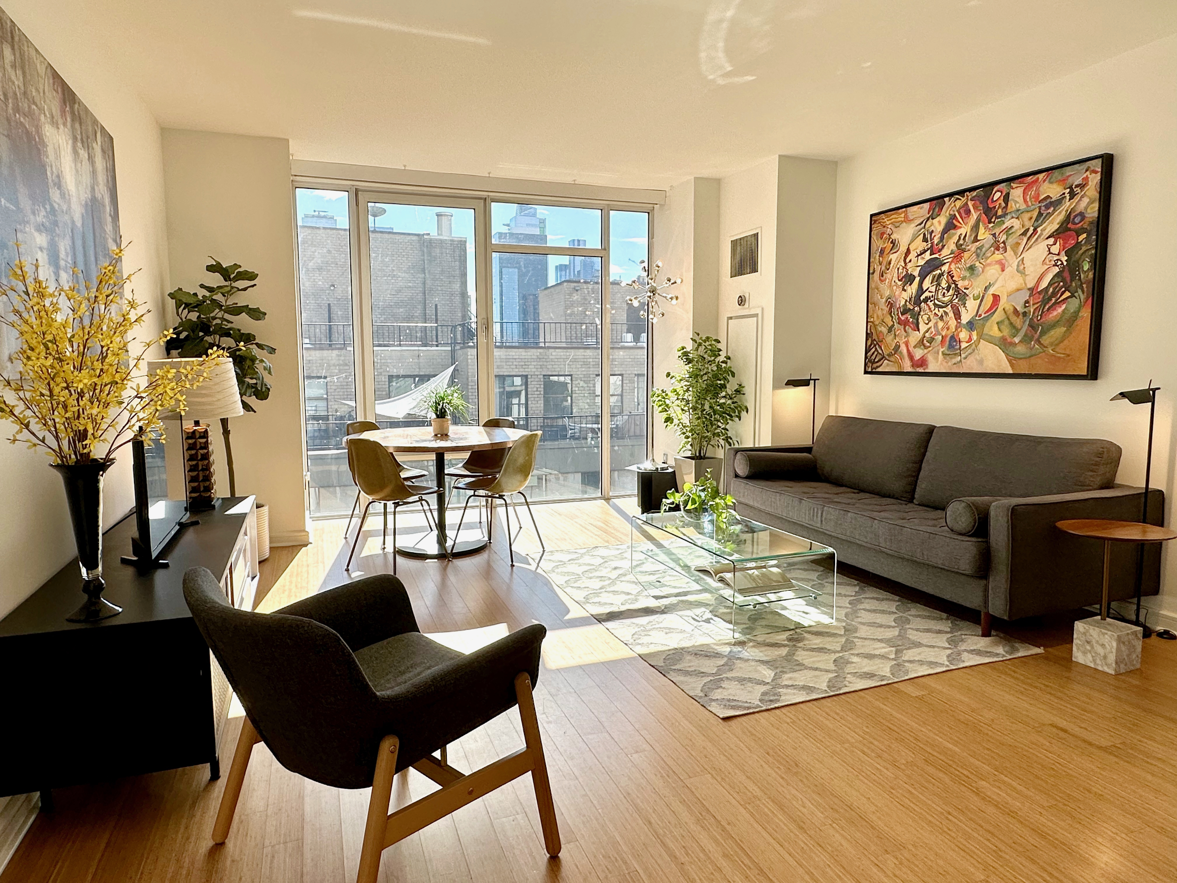 350 West 53rd Street, Unit PHA Manhattan, NY 10019 - Photo 2 of 35 a living room with furniture and a large window