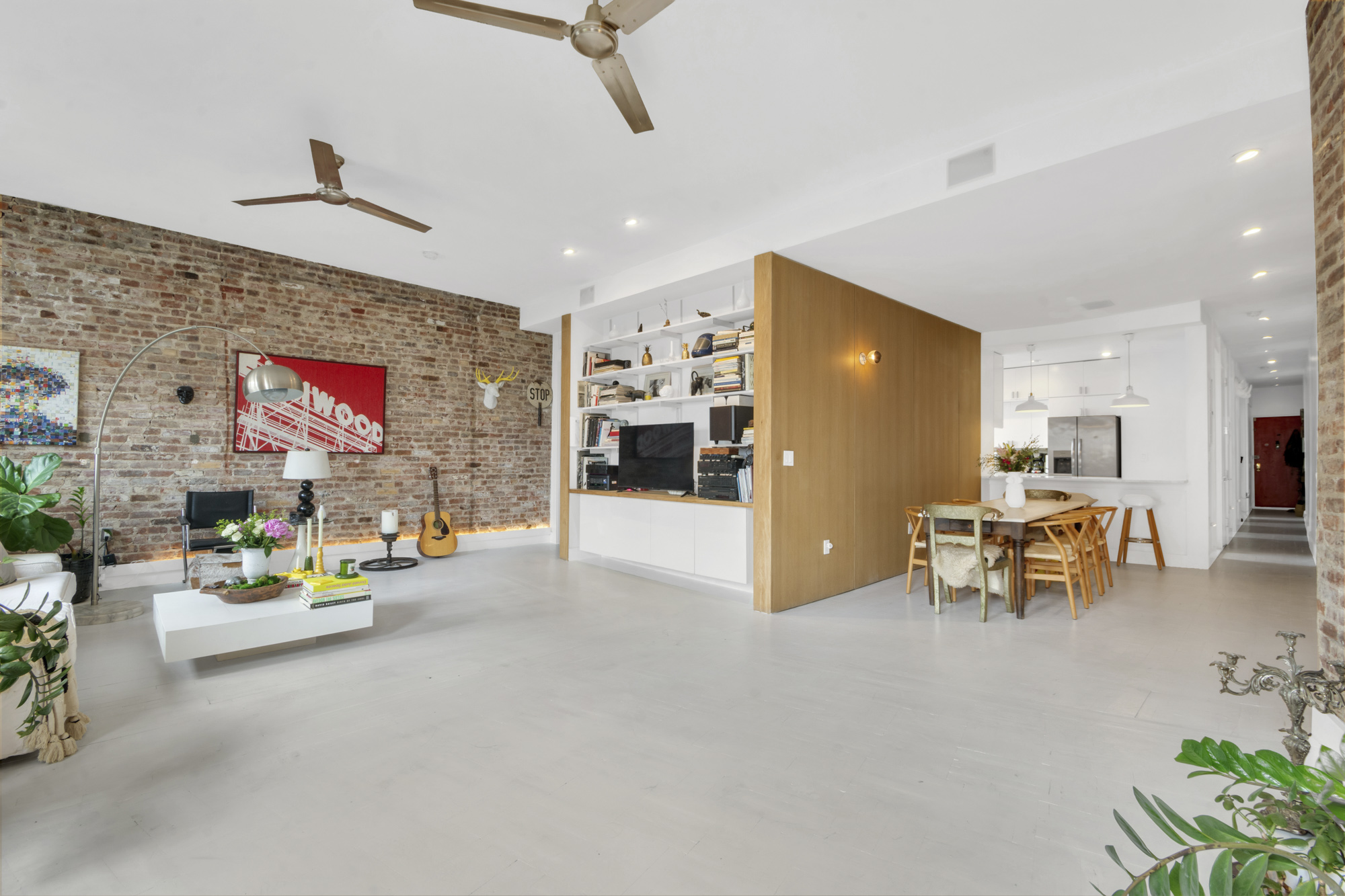 47 Fort Washington Avenue, Unit 61 Manhattan, NY 10032 - Photo 3 of 14 a living room with furniture and kitchen view