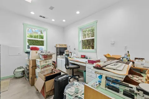 a black and white photo of a living room