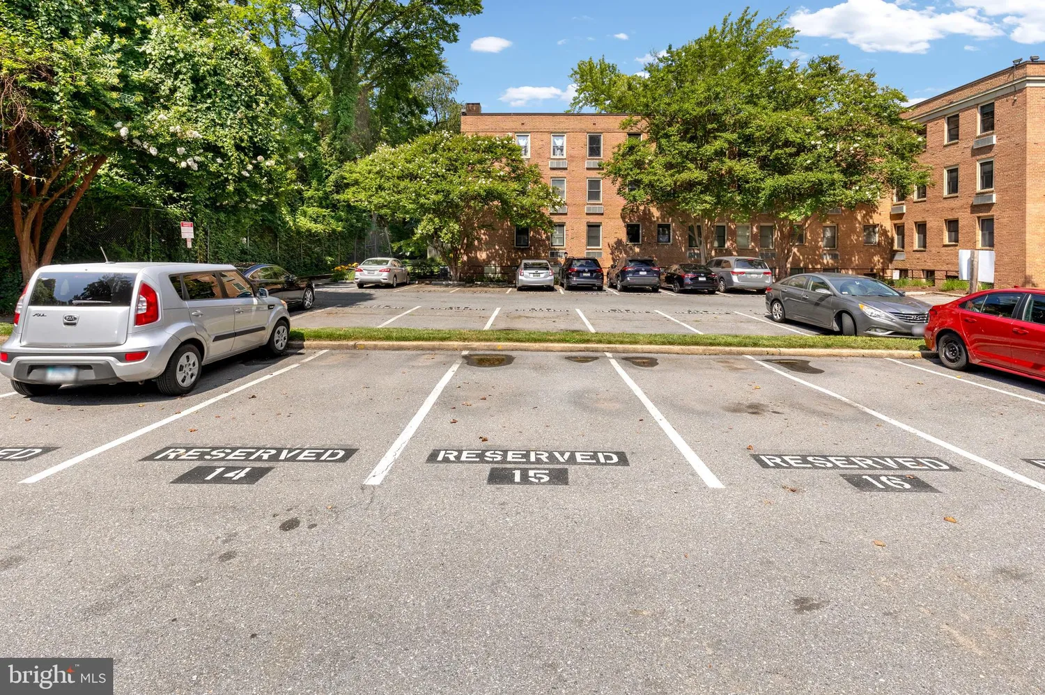 a view of street with parked cars