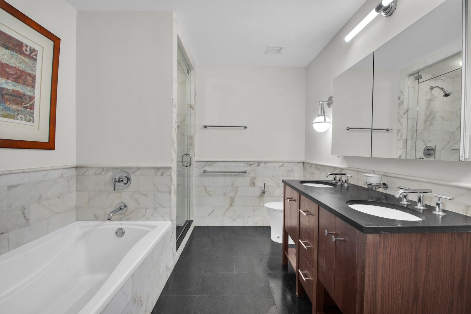 454 West 54th Street, Unit PHC Manhattan, NY 10019 - Photo 13 of 27 a bathroom with a tub a sink and mirror