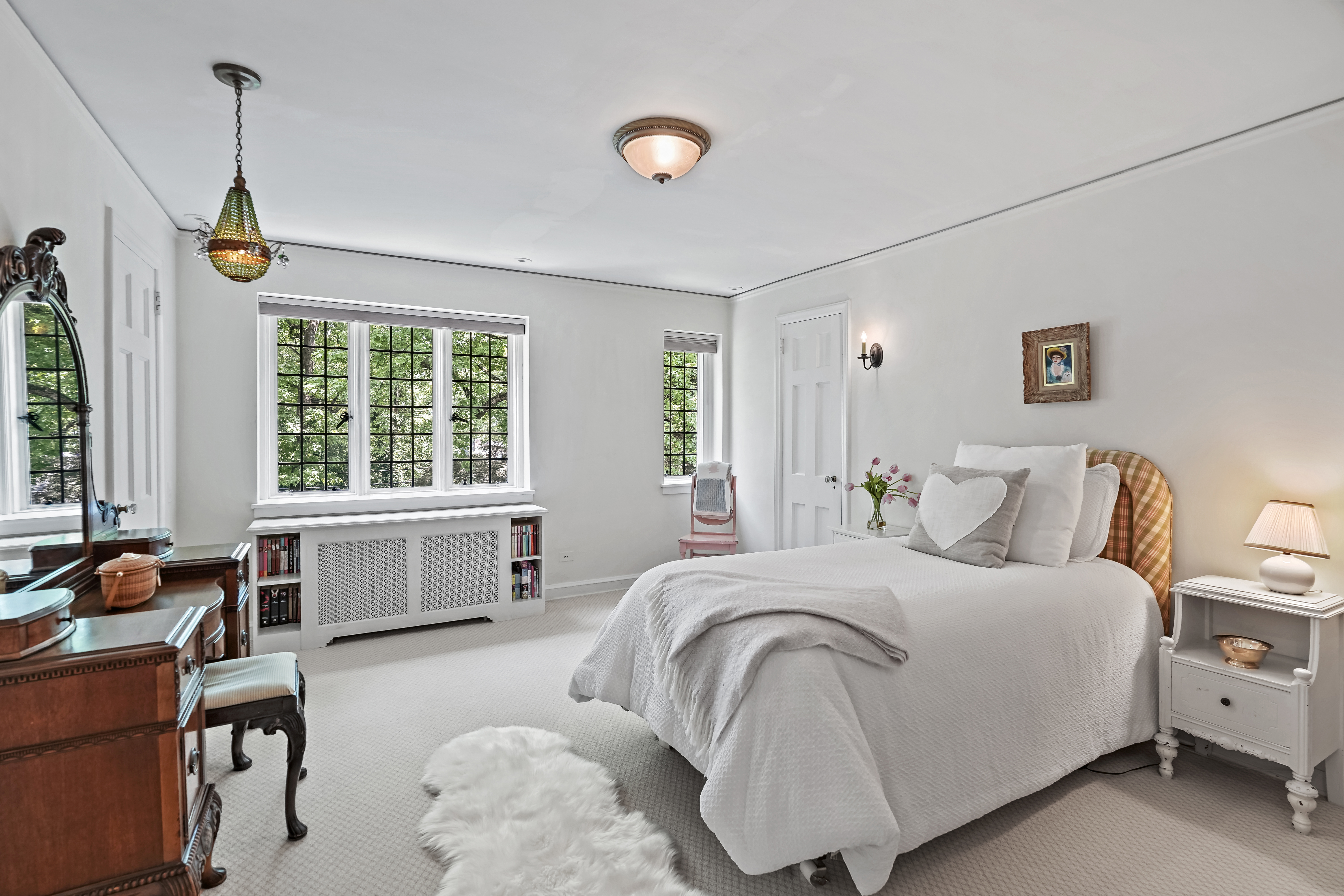 19 Avon Road Larchmont, NY 10538 - Photo 14 of 35 a bedroom with bed and a large window