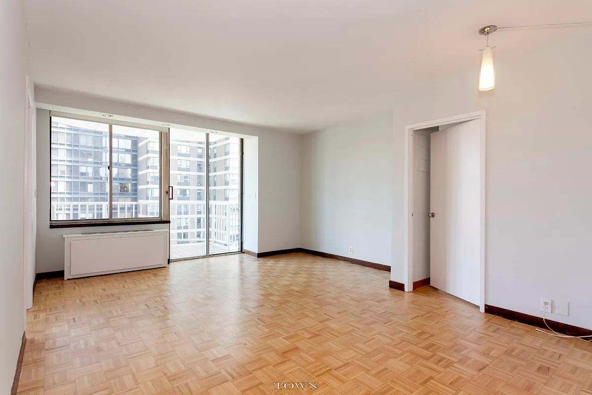 420 East 58th Street, Unit 17B Manhattan, NY 10022 - Photo 2 of 12 a view of an empty room with a window
