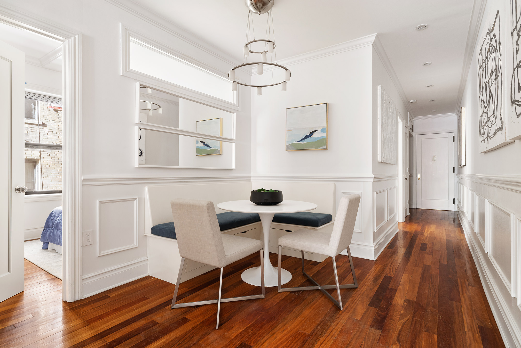 203 West 81st Street, Unit 3A Manhattan, NY 10024 - Photo 3 of 12 a view of a dining room with furniture wooden floor and chandelier