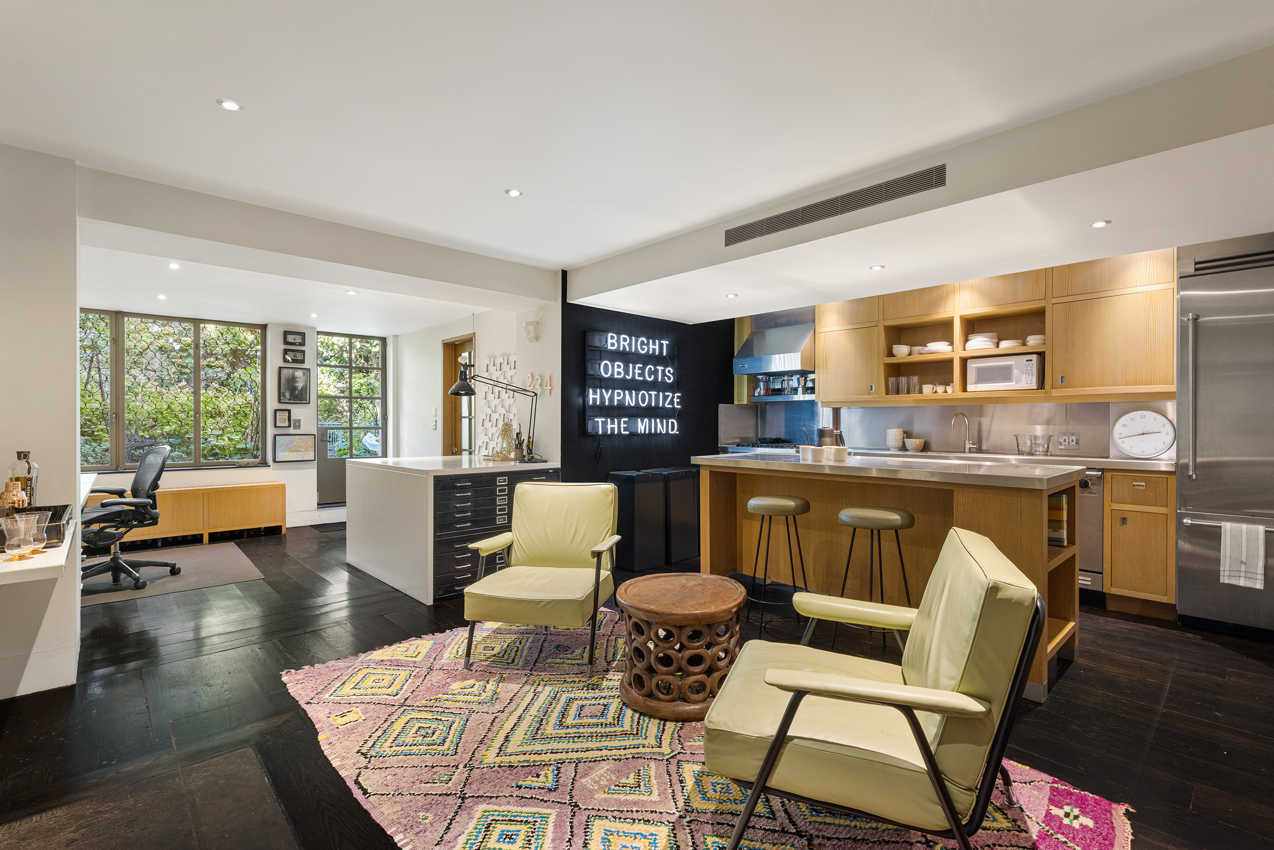 25 Perry Street Manhattan, NY 10014 - Photo 27 of 32 a living room with furniture and a large window