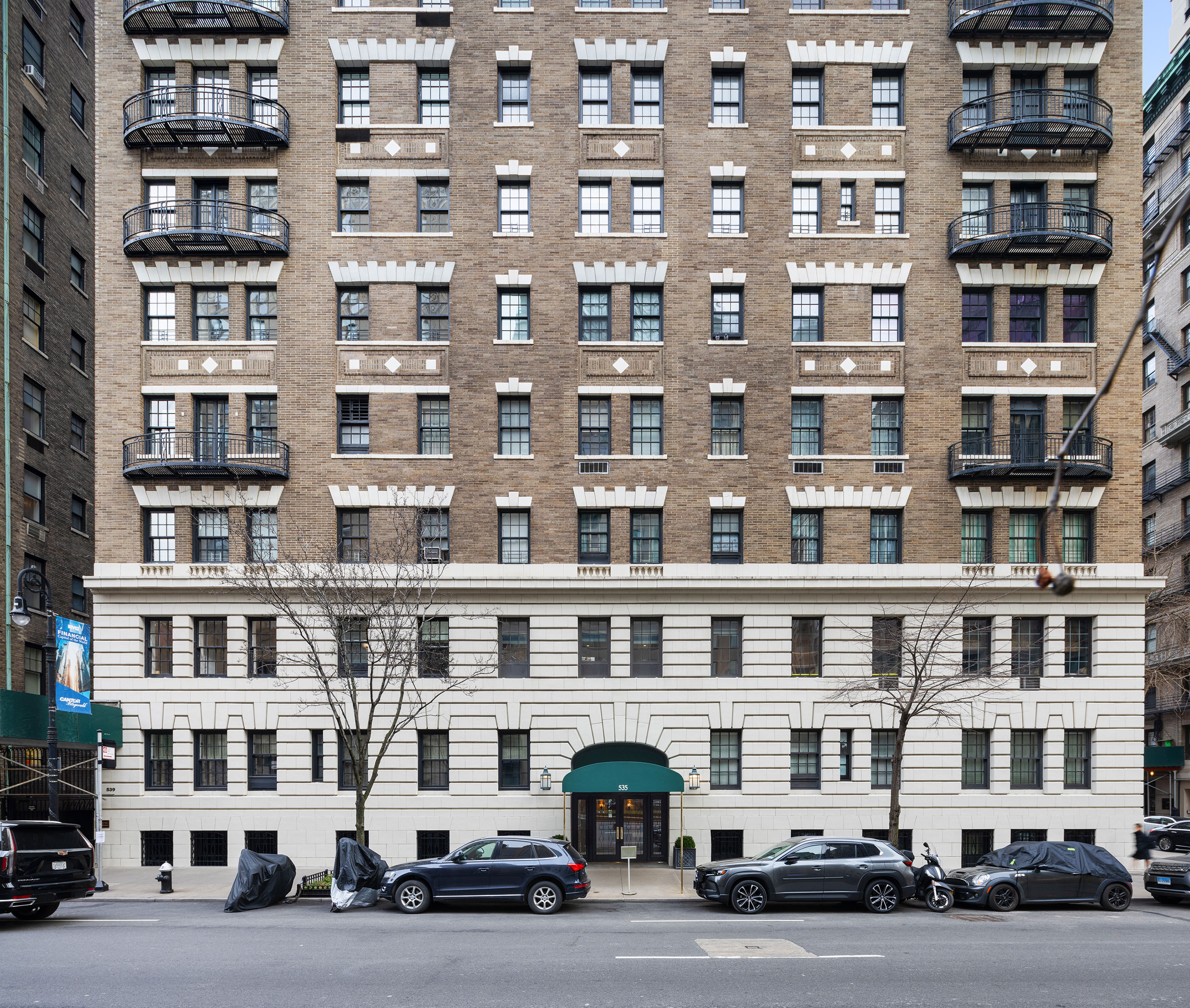 535 Park Avenue, Unit 14C Manhattan, NY 10065 - Photo 17 of 18 a front view of a building with lot of windows